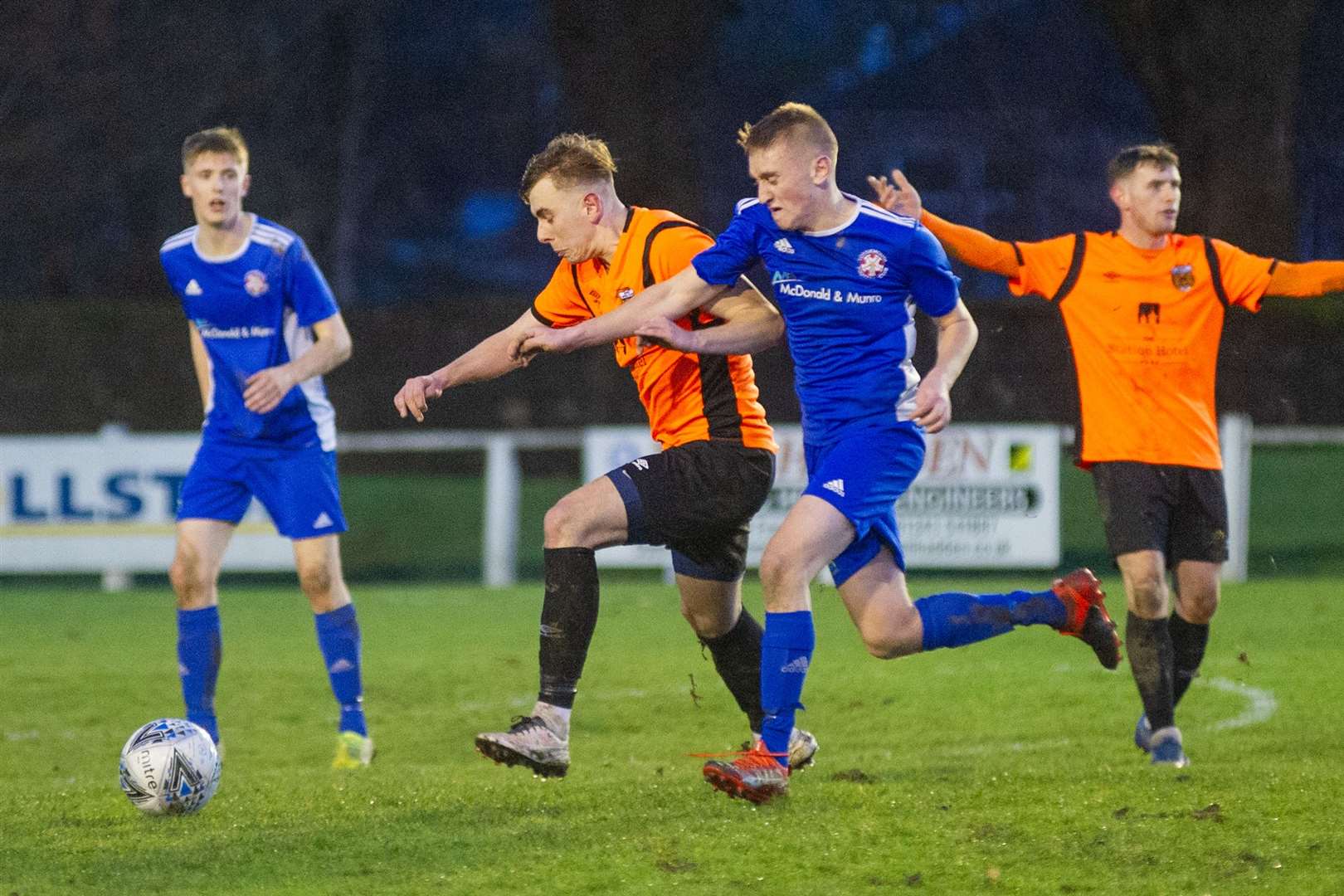 Fraser Robertson (centre) was Rothes' match winner against Huntly. Picture: Daniel Forsyth..