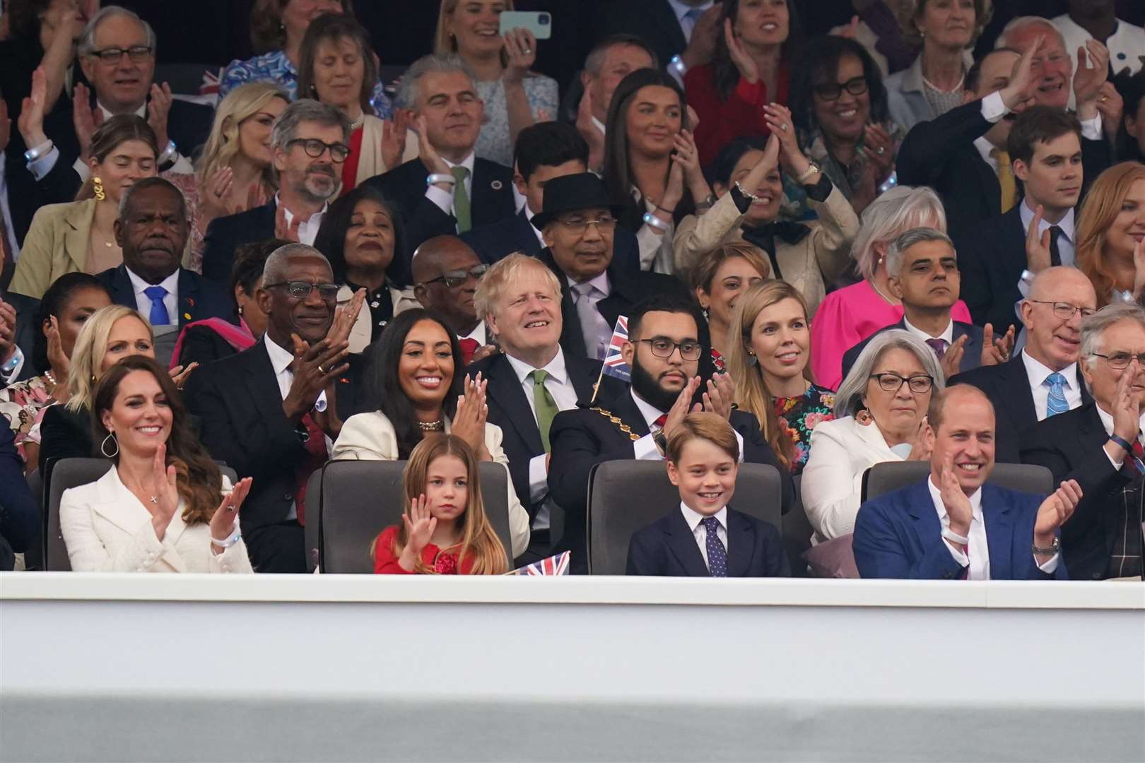 The Cambridge family in the front row (Jacob King/PA)