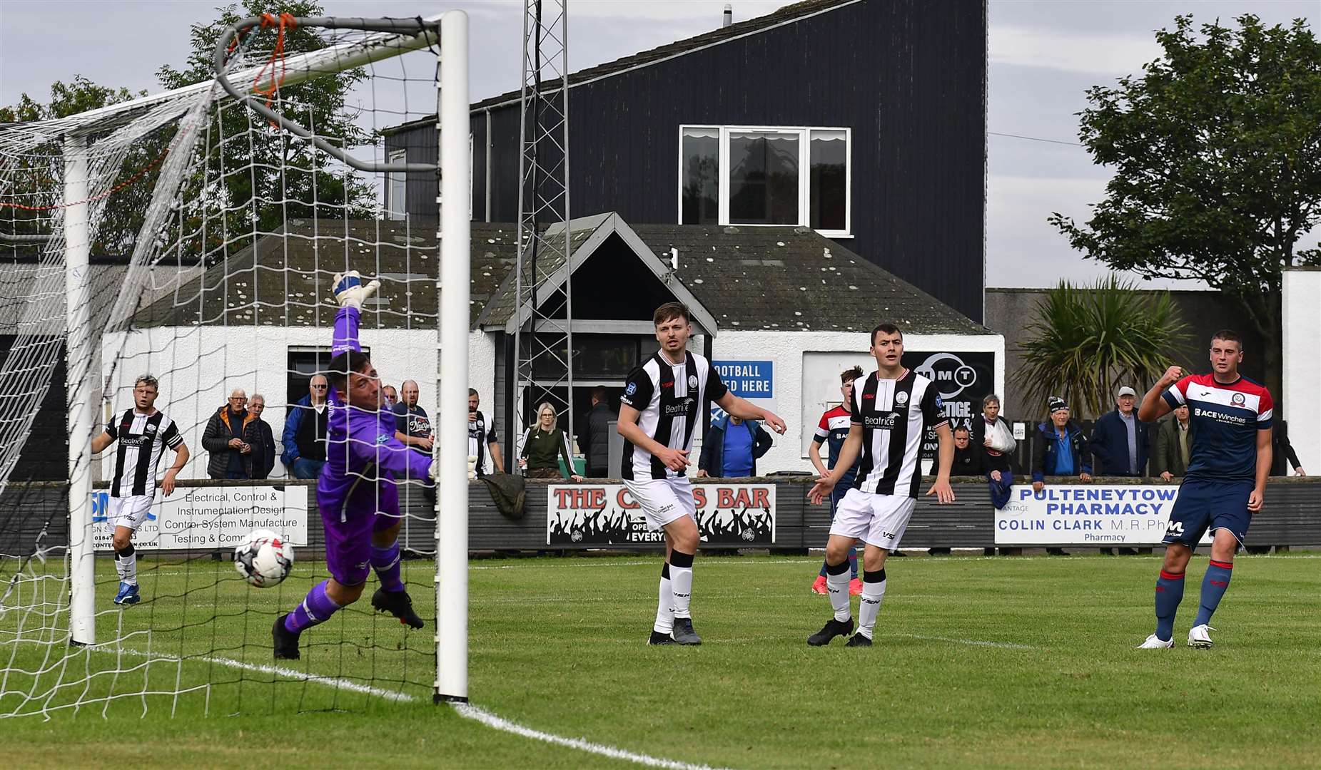 Matty McDonald turns to celebrate as his header beats Wick keeper Graeme Williamson to bring Turriff level. Picture: Mel Roger