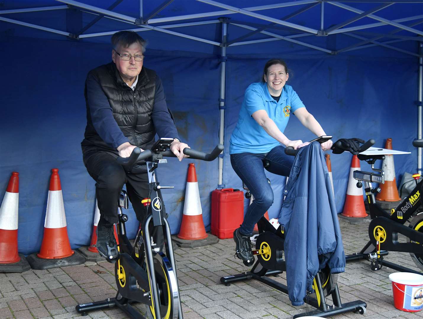 Captain Alan McIntosh and Laura Taylor help rake in the pounds at the cycle fundraiser. Picture: Beth Taylor