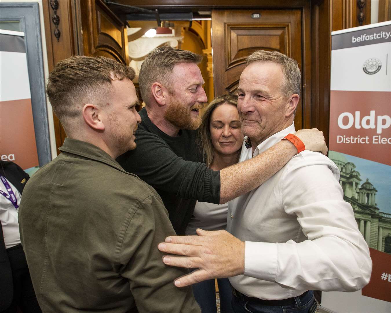 Sinn Fein’s JJ Magee (right) celebrates winning a seat on Oldpark at Belfast City Hall during a night of success for the party in local government elections (Liam McBurney/PA)