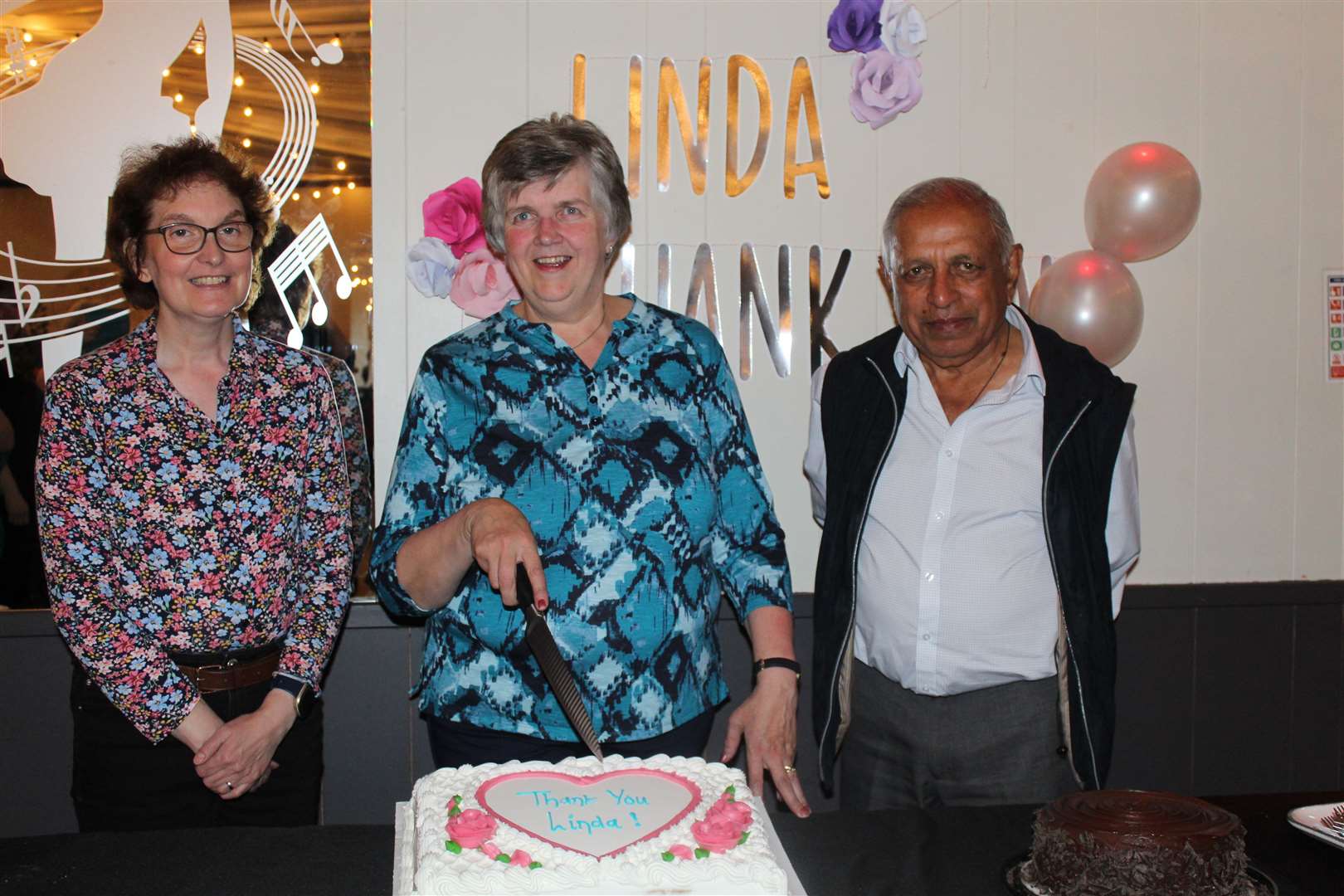 Retiring development worker with Grampian Opportunities (GO) Linda Singer (centre) with her successor, manager Tricia McLean and Pushp Vaid, trustee chairman at Linda's farewell party at the Drouthy Laird last week. Picture: Griselda McGregor