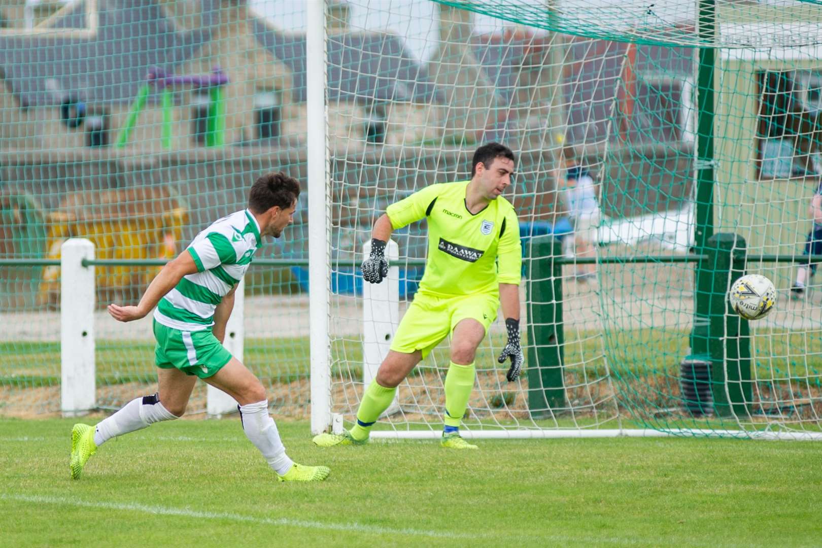 Sam Urquhart scores his second of the afternoon past former Buckie keeper Daniel Bell. Picture: Daniel Forsyth..