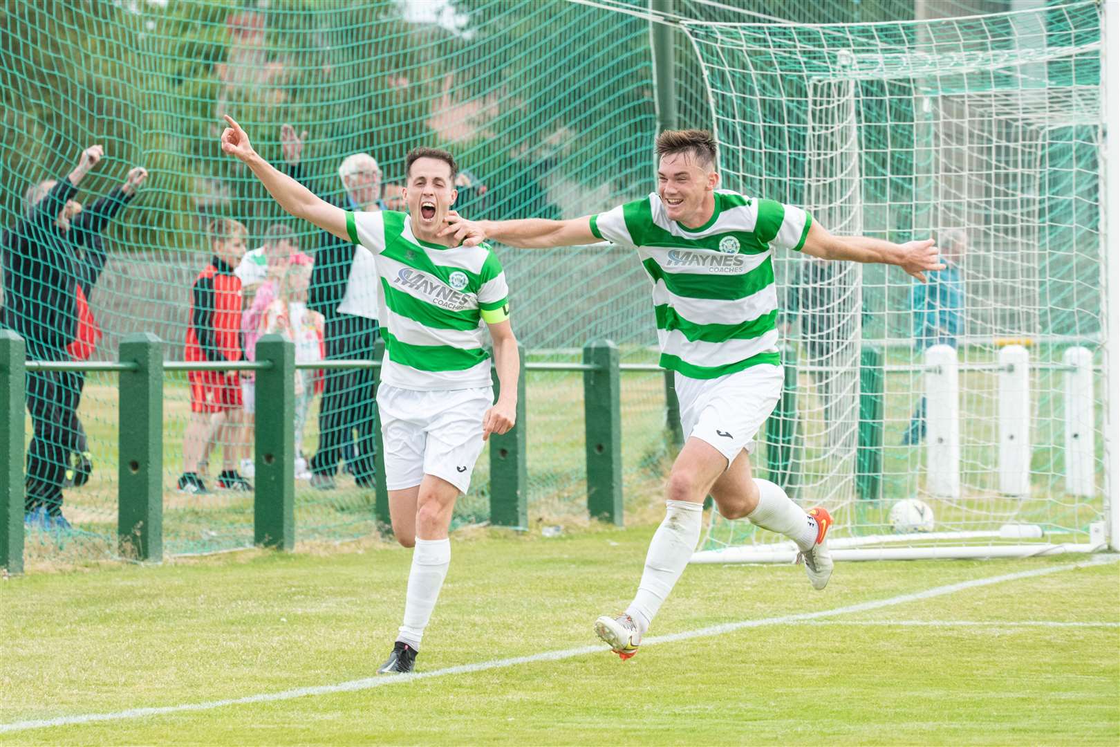Kevin Fraser (left) wheels away to celebrate a goal against Wick Academy with team mate Jack Murray. Picture: Daniel Forsyth