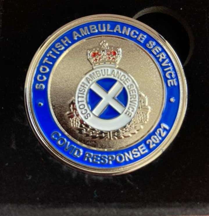 Inverurie's First Responders team was presented with a commemorative coin which recognises outstanding dedication and care.