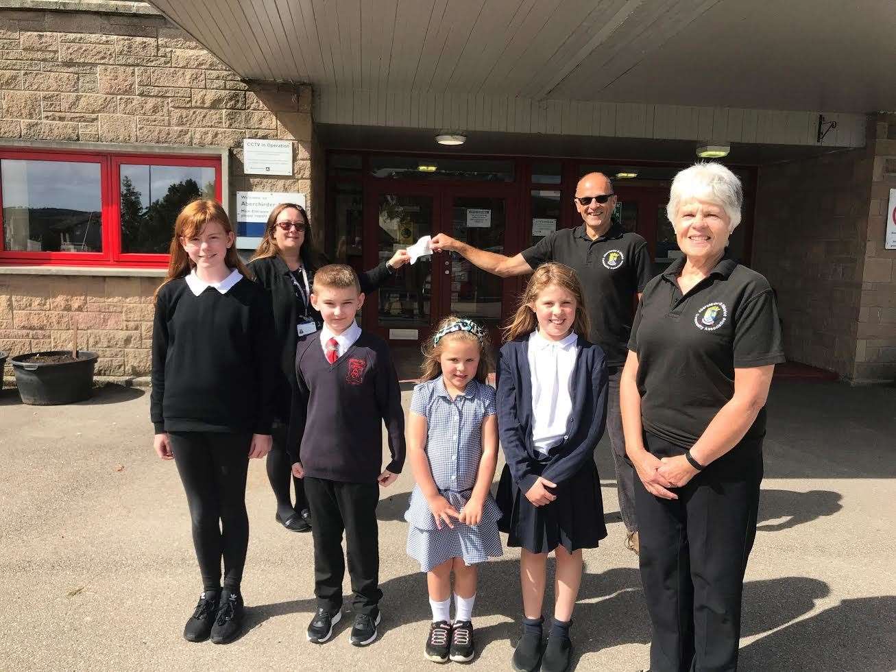 Pupils Imogen Duncan, Archie Donald, Becca Brown, Olivia Brown welcomed Brenda King and Richard Waters who handed over the cheque to Jennifer Astridge.