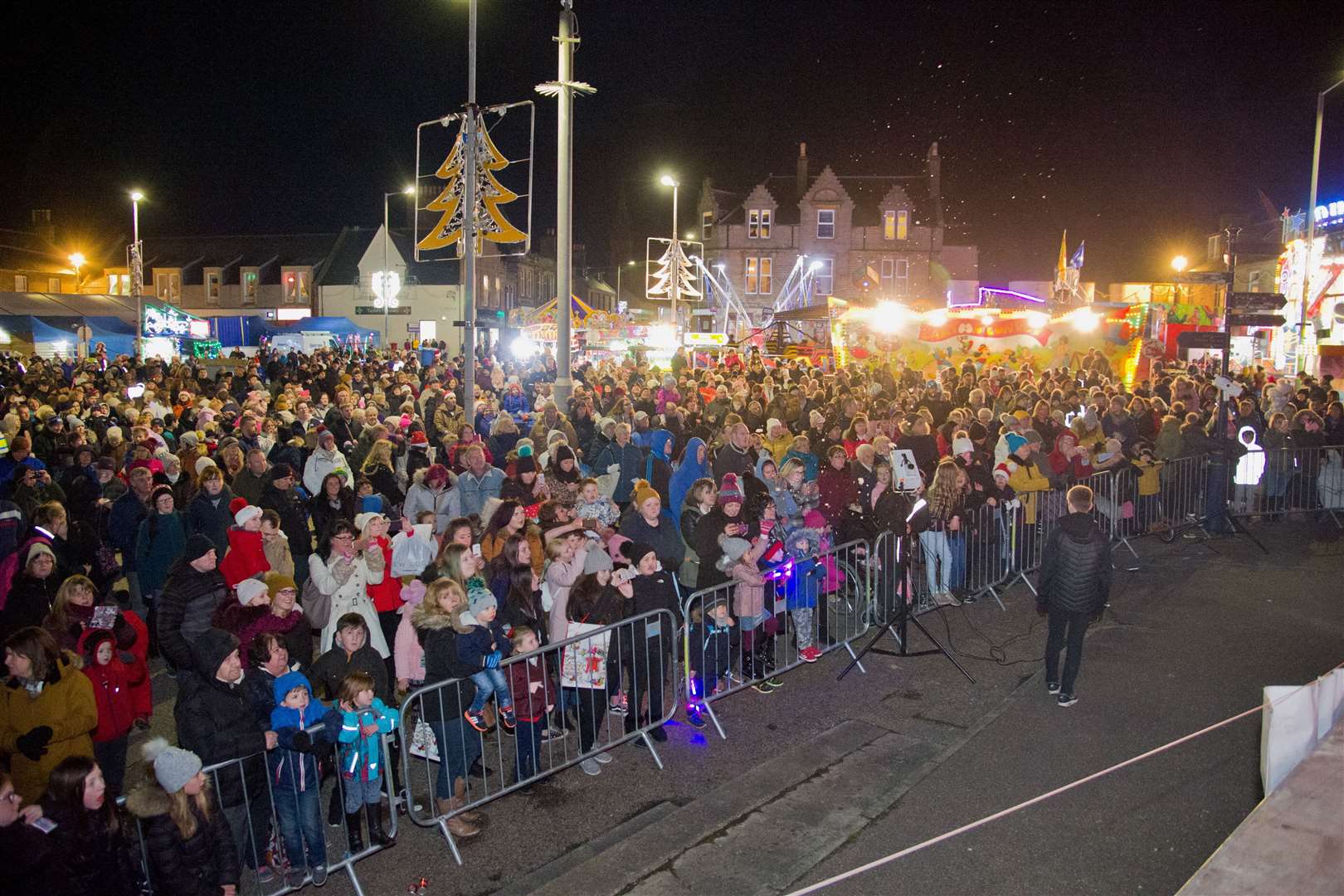 A large crowd gather in Cluny Square to watch the lights getting switched on at last year's Buckie Christmas Kracker. Picture: Daniel Forsyth. Image No.042716