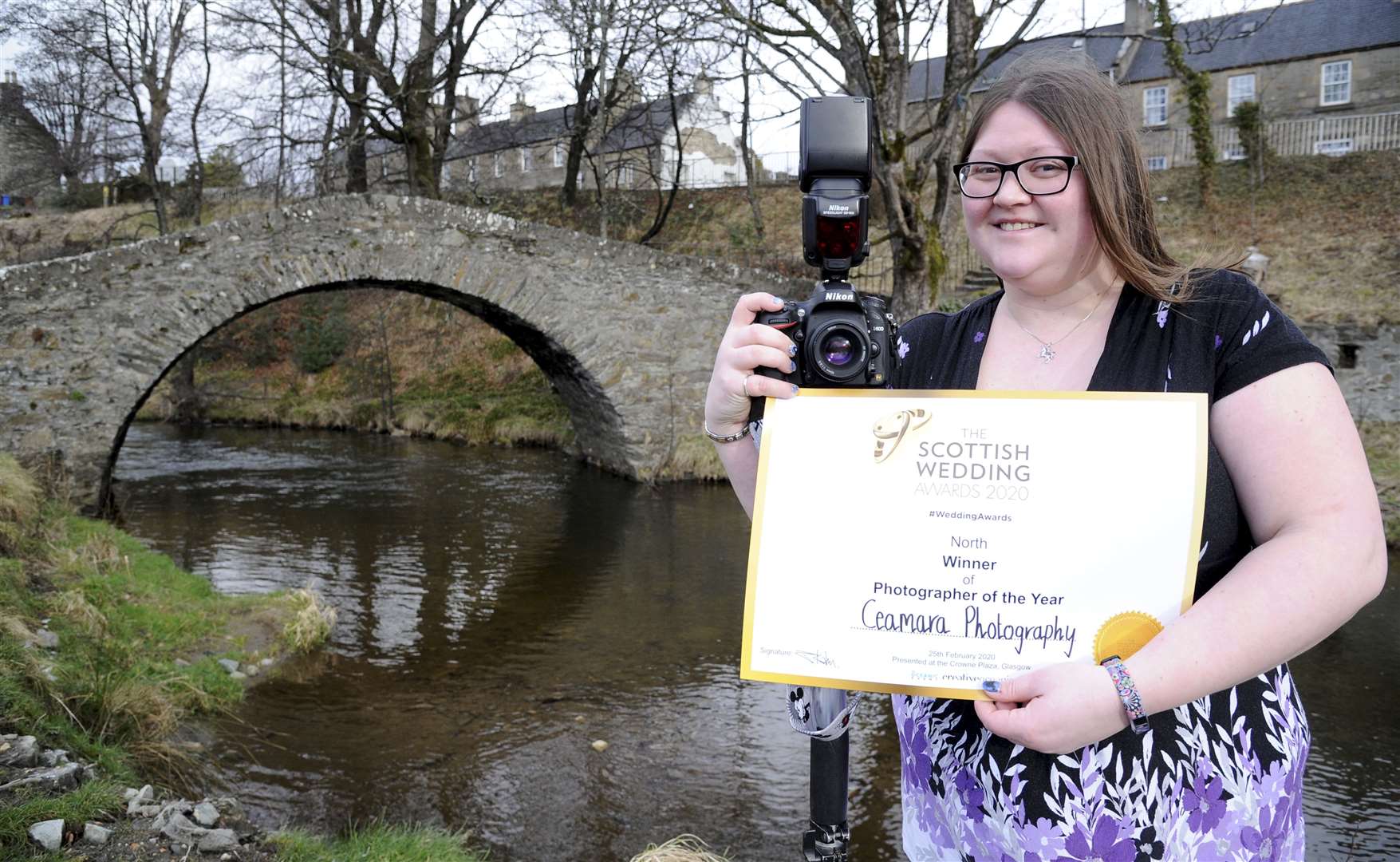 Morag Martin, from Keith, who won Scottish Wedding Photographer of the Year, pictured beside the historic Auld Brig in the town. Picture: Eric Cormack