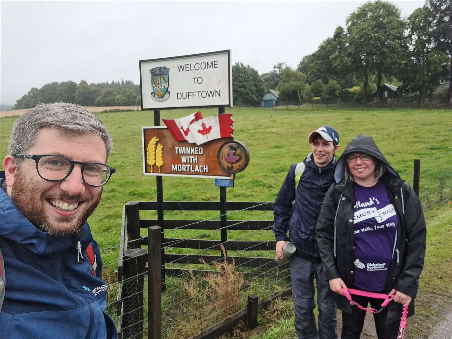 Garry, Stephen and June at the Dufftown-Mortlach sign.