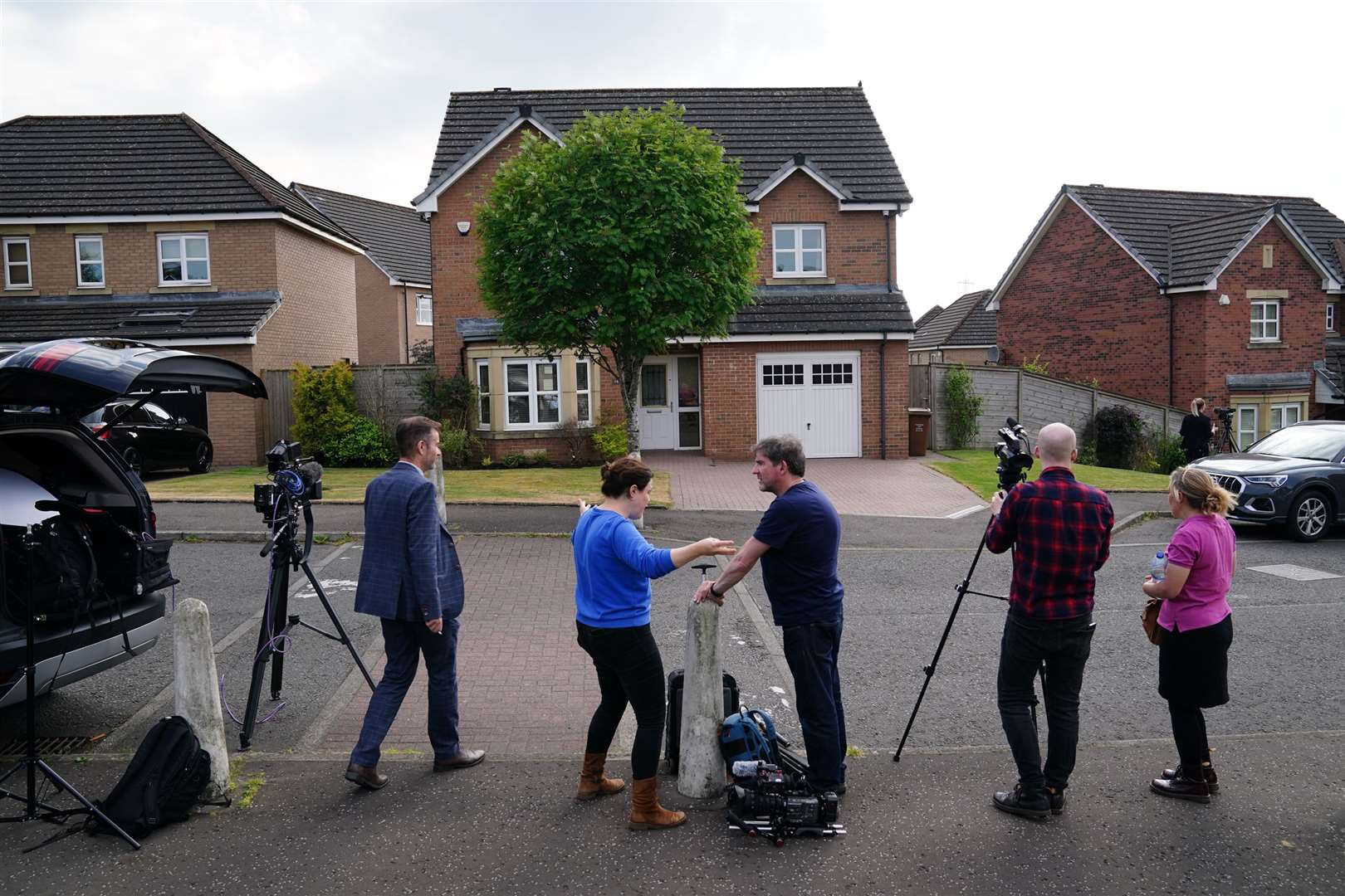 Members of the media outside former first minister of Scotland Nicola Sturgeon’s home in Uddingtson, Glasgow (Jane Barlow/PA)