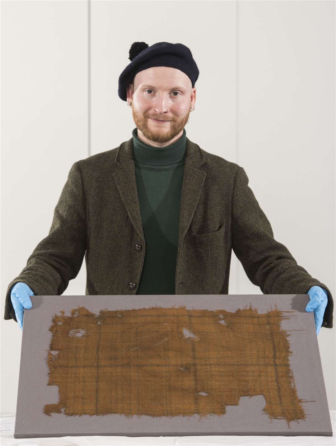 V&A Dundee curator James Wylie with the Glen Affric tartan (Alan Richardson/V&A/PA)