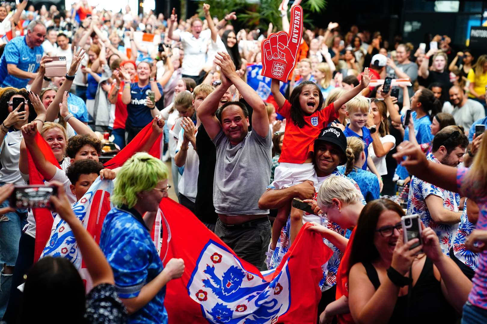 England fans celebrate following a screening of the FIFA Women’s World Cup 2023 semi-final (Victoria Jones/ PA)