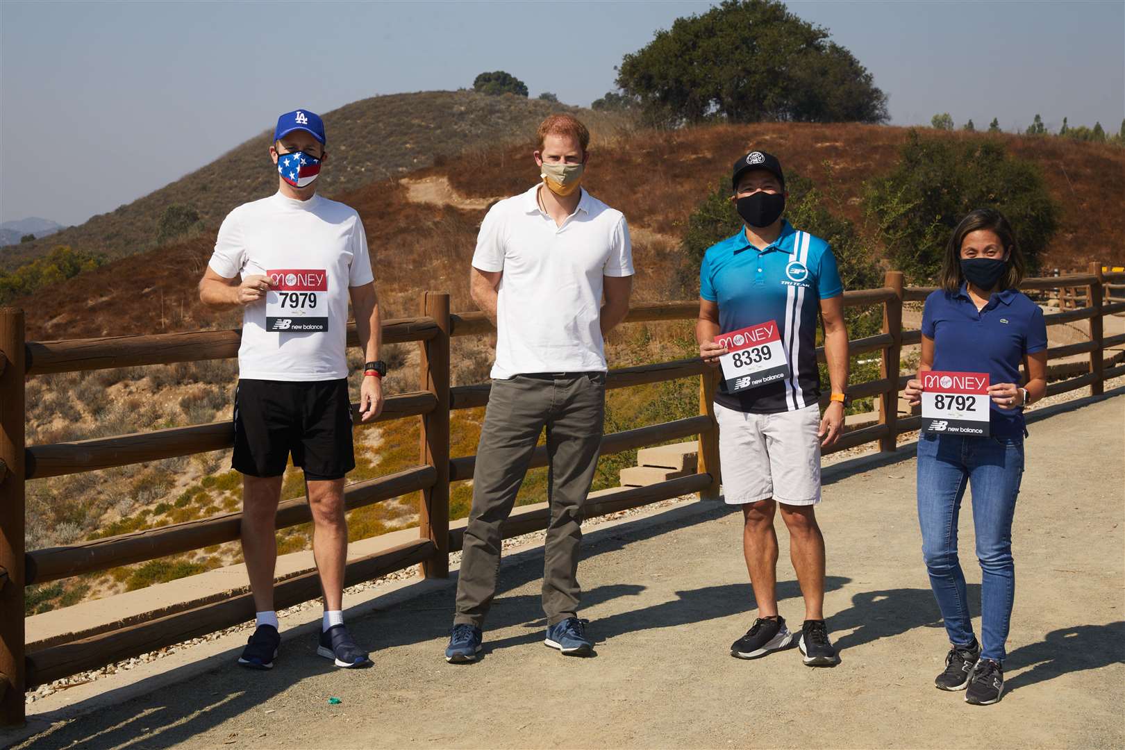 The Duke of Sussex, patron of the London Marathon Charitable Trust, poses with runners in Los Angeles before they take on the virtual Virgin Money London Marathon (Bob Martin/London Marathon Events/PA)