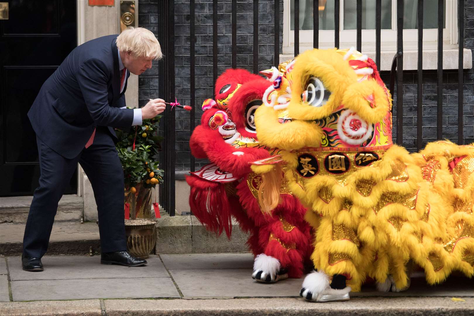 Mr Johnson welcoming members of the Chinese community at 10 Downing Street, for Chinese New Year celebrations on January 24 (Stefan Rousseau/PA)