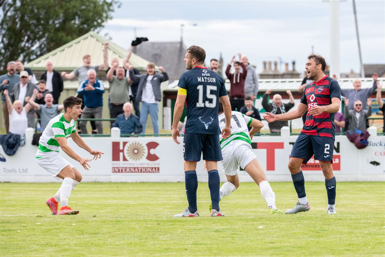 Buckie Thistle's Sam Urquhart (centre, hidden) wheels away to celebrate his opener with team mate Max Barry. ..Buckie Thistle (1) vs Ross County (1) - Ross County win the penalty shootout - Premier Sports League Cup at Victoria Park, Buckie, 09/07/2022...Picture: Daniel Forsyth..