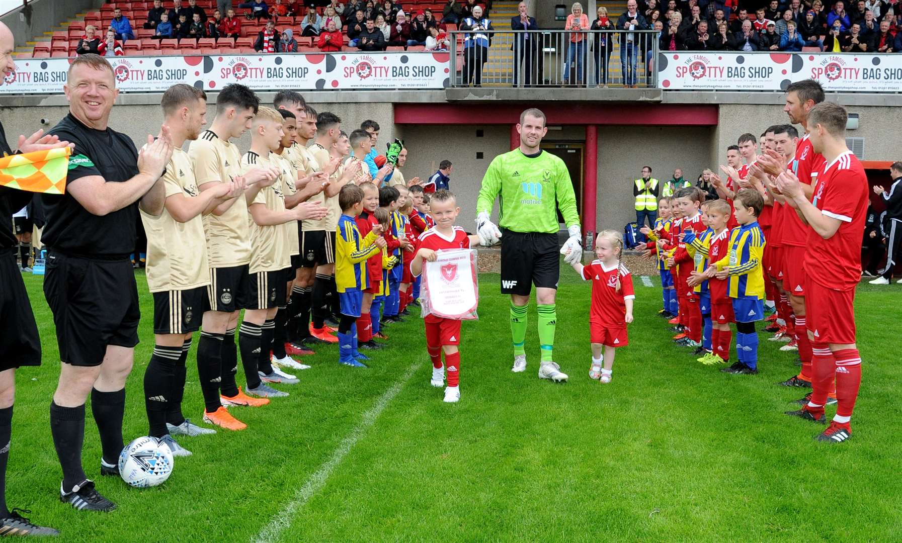 James Blanchard arrives on the Princess Royal Park pitch with his children Logan And Kayla for his testimonial game against Aberdeen. Photo: Eric Cormack.