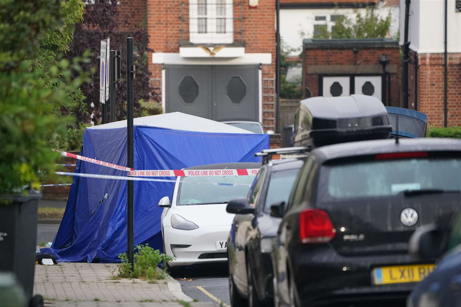 A blue forensic tent has been put up in Kirkstall Gardens as police gather evidence (Jonathan Brady/PA)