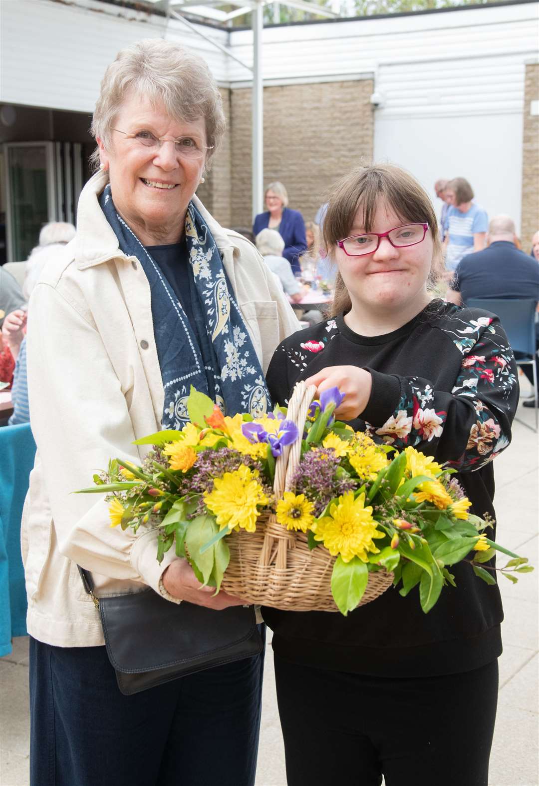 Pat Emslie was presented with flowers from former pupil Jane Rennie at a surprise aprty to mark her retirement from The Gordon Schools in Huntly after 44 years of service. Picture: Daniel Forsyth.