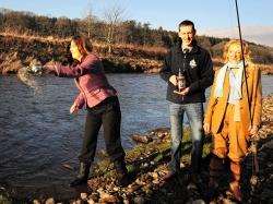 Eilidh Whiteford MP officially opening the 2012 angling season with a customary dram for the River Deveron. Looking on is senior biologist Richard Miller and Jean Marshall who had the honour of making the first cast of the season.