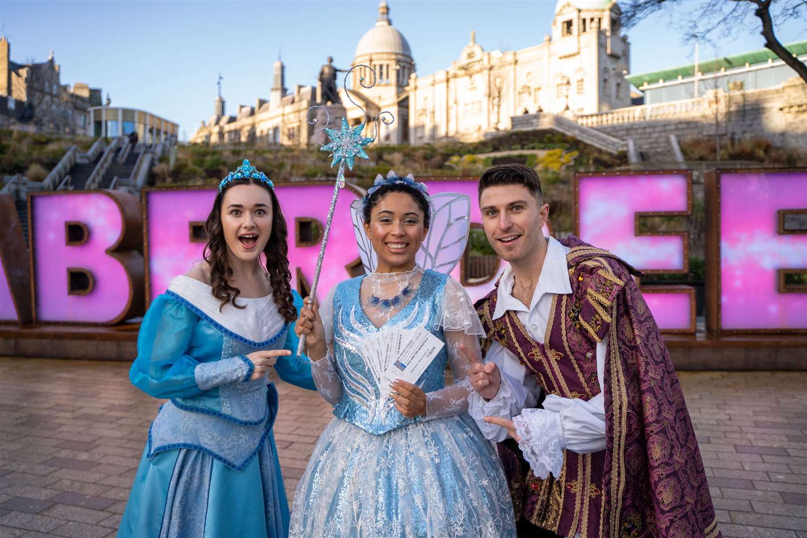 Jemma Ferries (Princess Aurora), Danielle Jam (The Spirit Of Pantomime) and Michael Karl-Lewis (Prince Angus)with the Aberdeen letters.. Picture: Aberdeen Performing Arts.