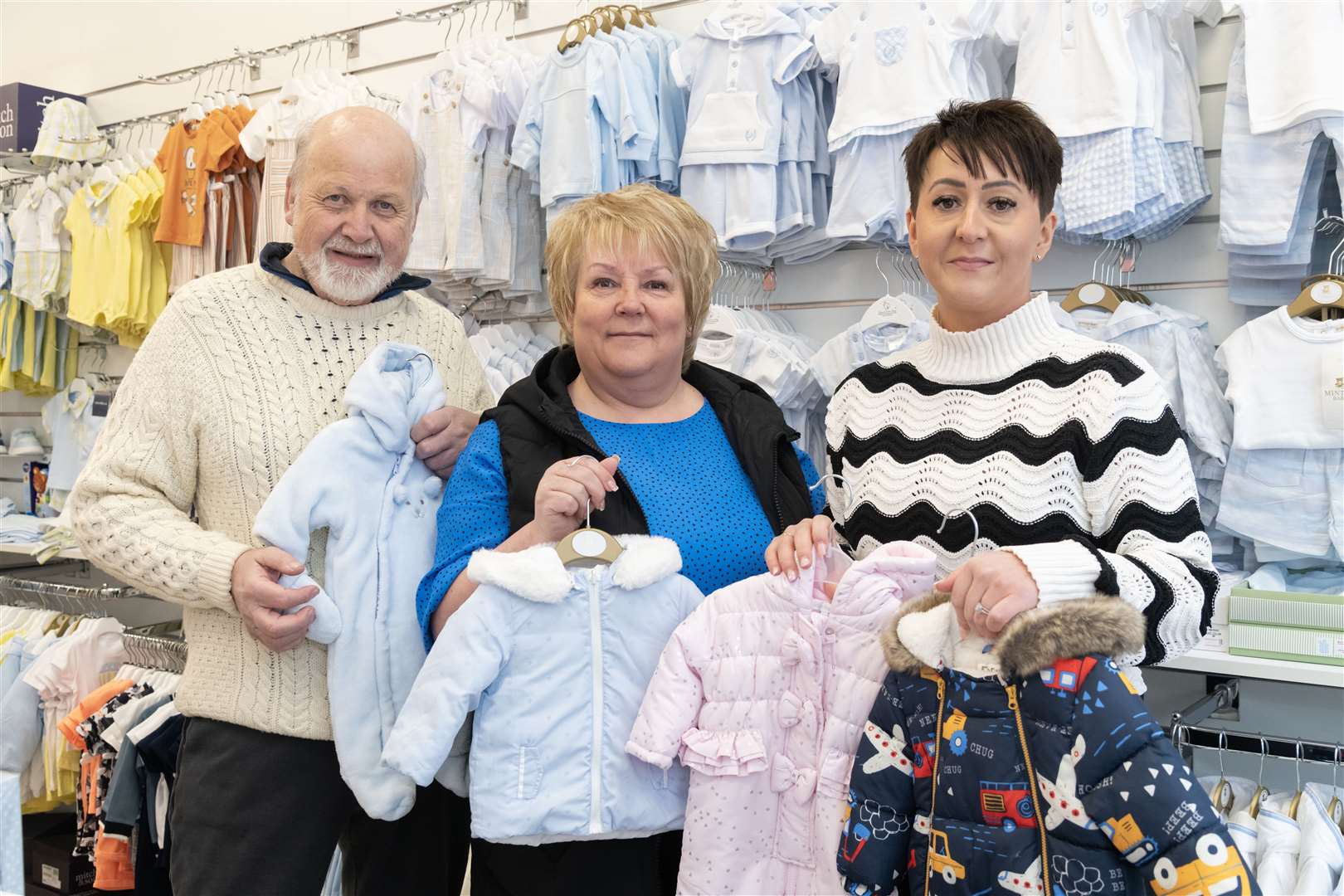 (From left) Buckie Area Forum Chair Gordon McDonald joins Gillian Hepburn and Ashleigh Main from TooCute Baby Bank Buckie to celebrate the £1,500 scholarship award.  Photo: Beth Taylor