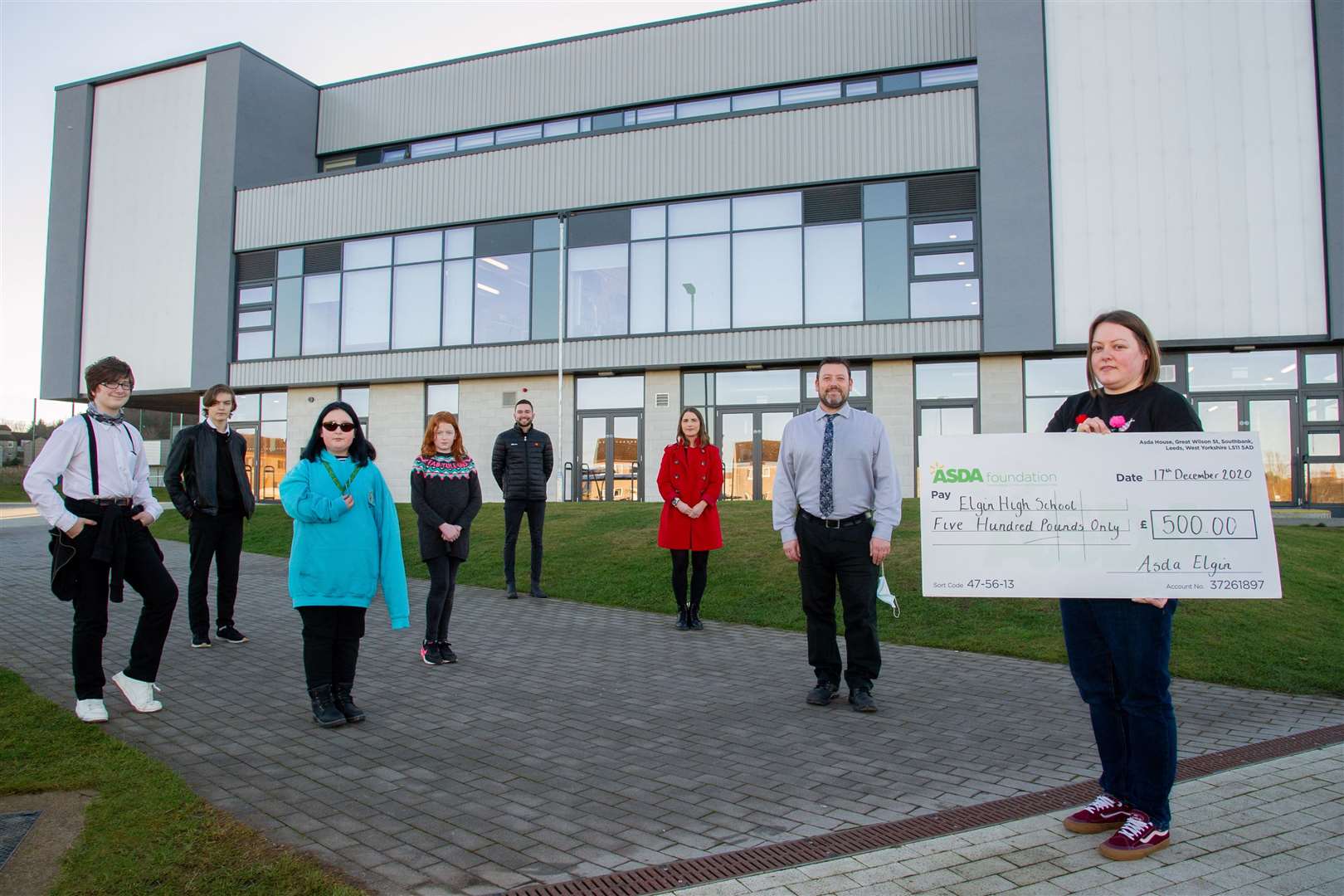 Elgin High School is one of the recipients of the 'Getting School's Back On Track' grant that the ASDA Foundation launched this year to support schools opening again after the lockdow. Left to Right: Pupils Athos Grieve, Adam Siddle, Megan Little, Kayla McNulty, Inclusion Project Co-ordinators Josh Davidson and Shelley Buchanan, head teacher Hugh McCulloch and ASDA community champion Kaye MacLeod...Picture: Daniel Forsyth..