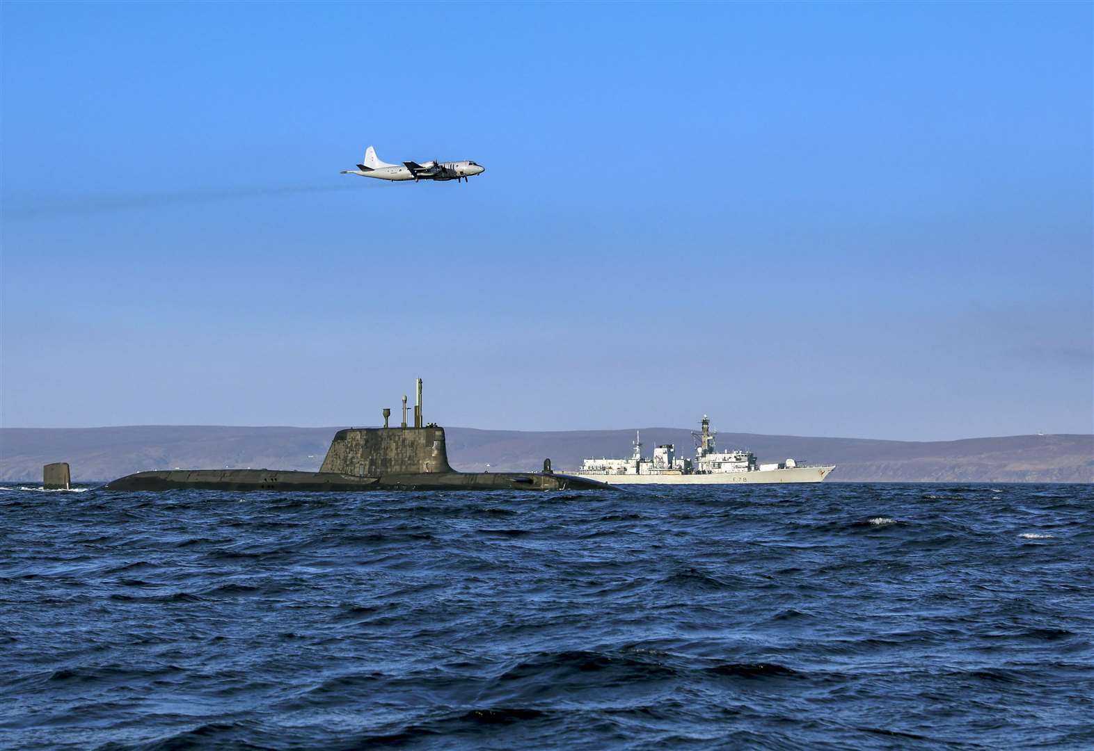 An Astute class nuclear submarine with a Type 23 frigate and a German Navy P3 maritime patrol aircraft.