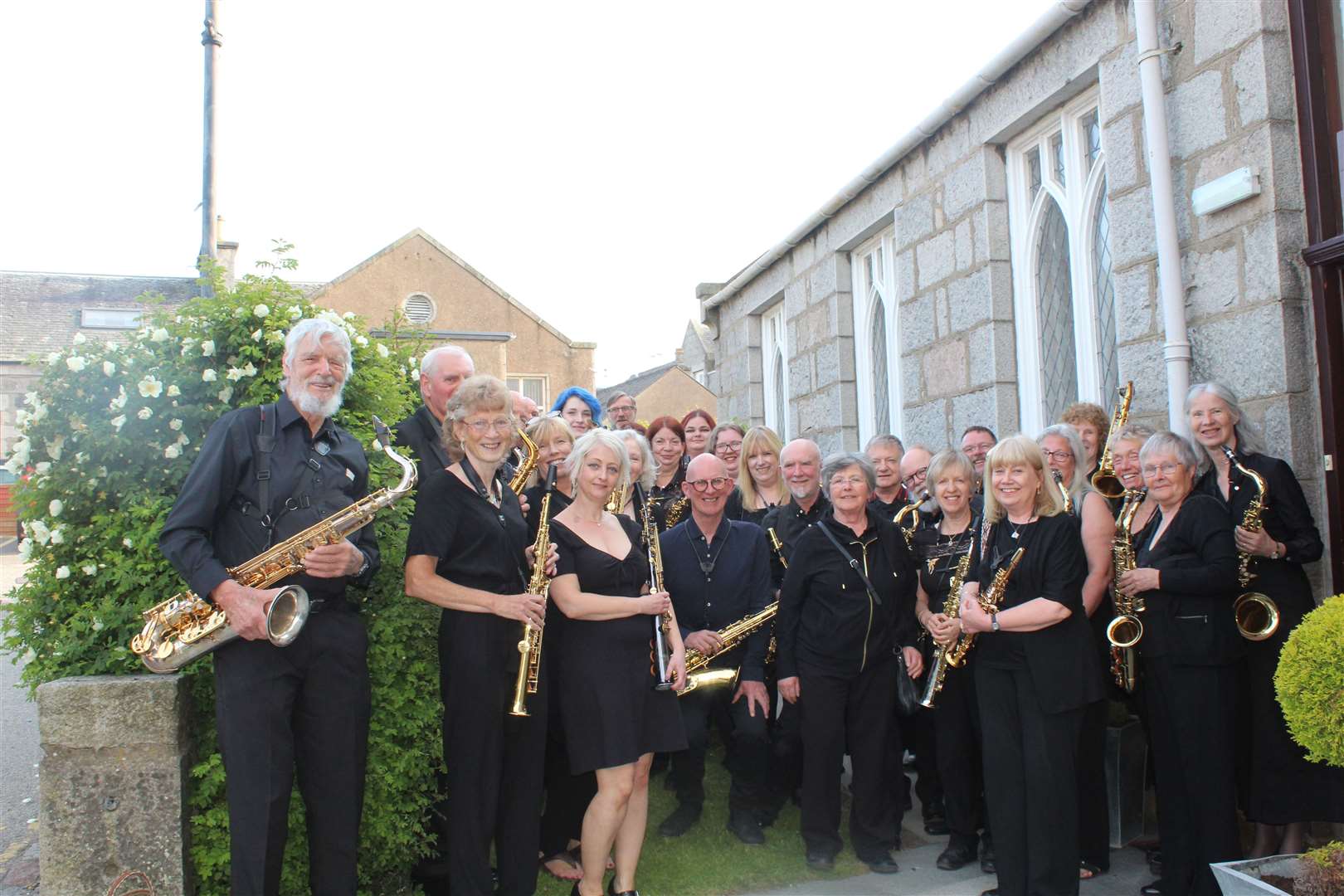 Members of the Aberdeenshire and Phoenix saxophone orchestras getting ready for their concert in the Acorn centre, West High Street, Inverurie on Saturday night . Picture: Griselda McGregor