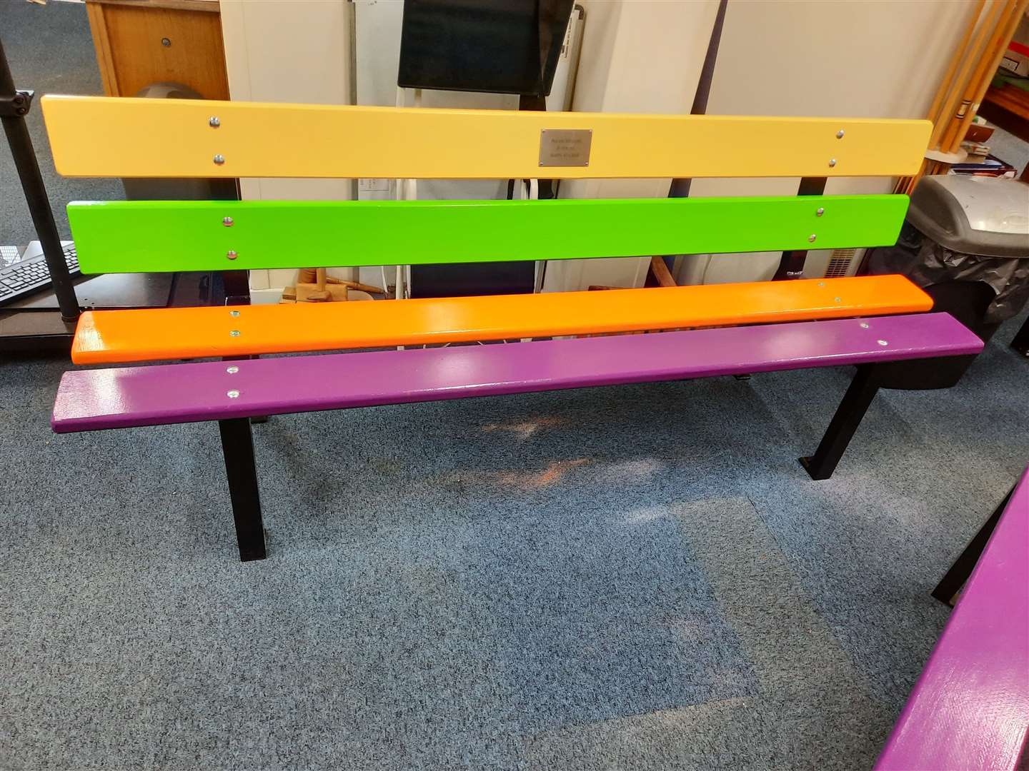 The brightly coloured benches were built and painted at Westhill Men's Shed.