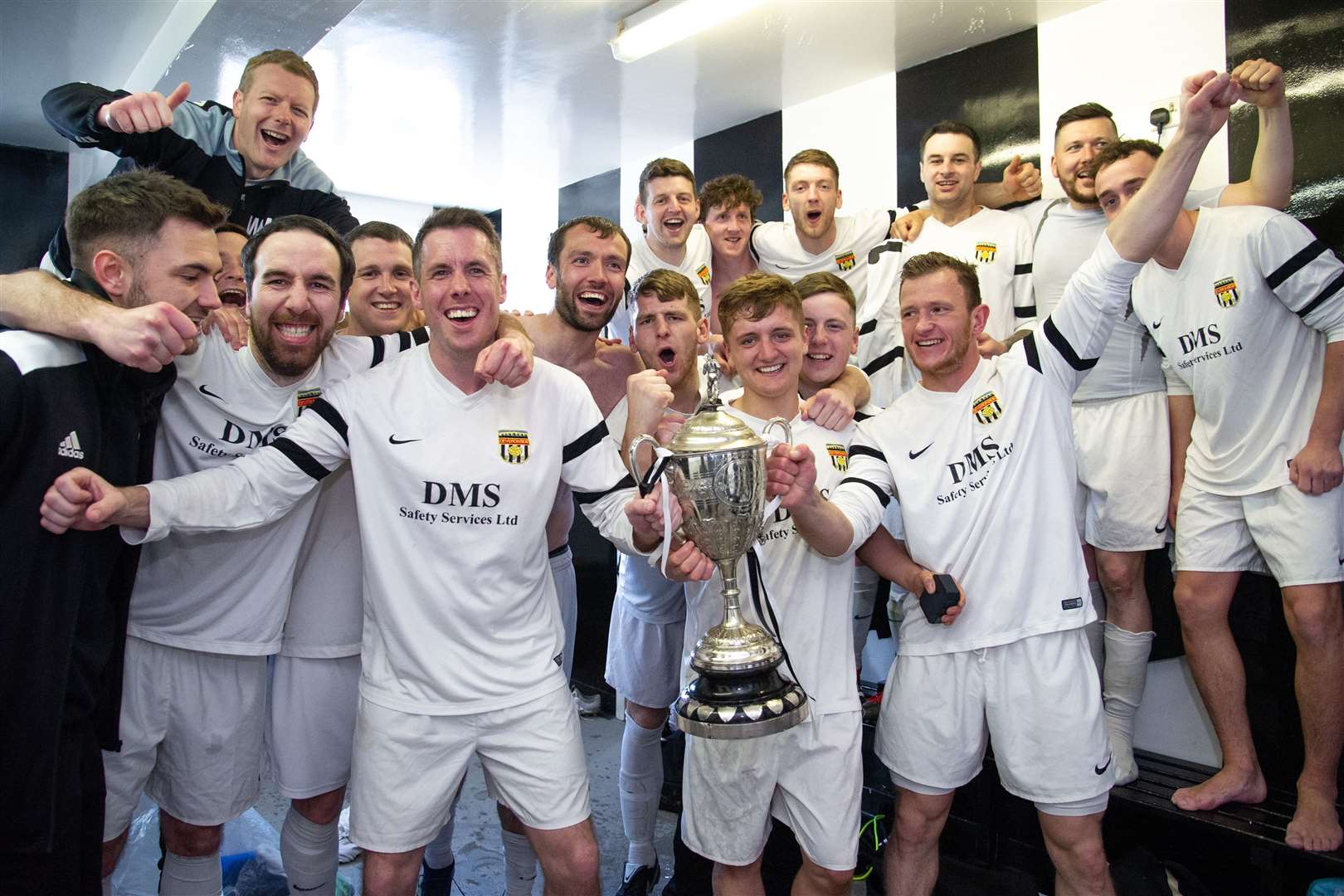 Deveronside celebrate their Elginshire Cup success in the Borough Briggs dressing room