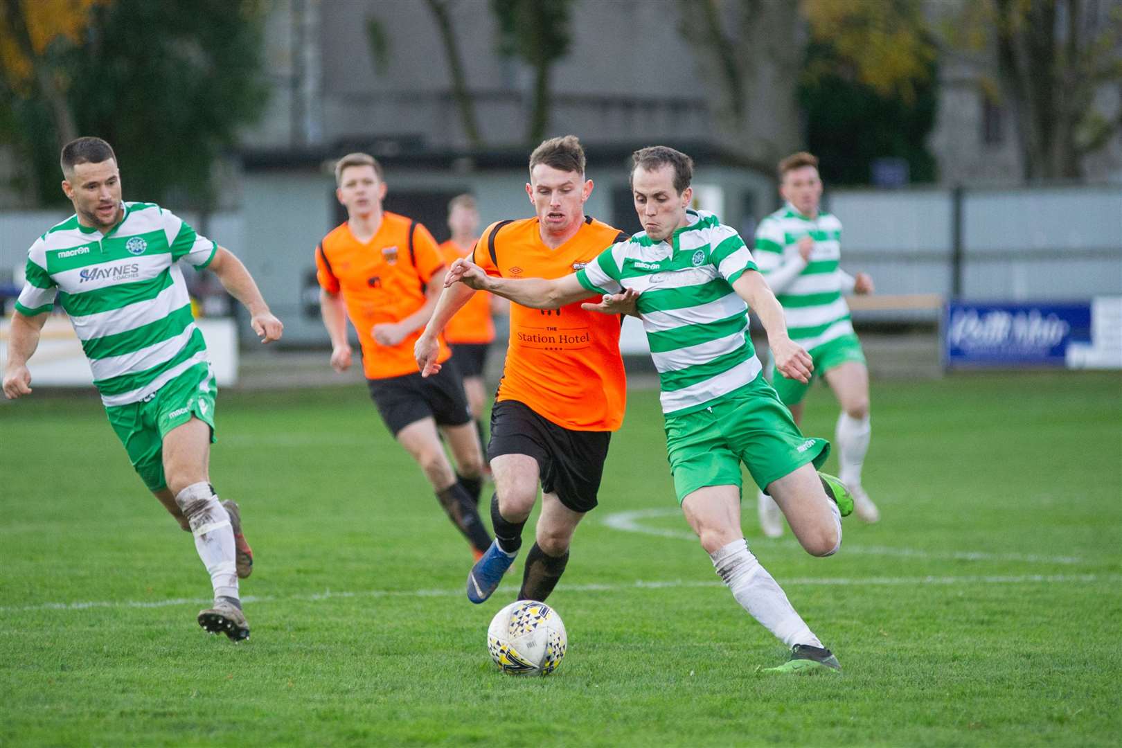 Rothes' Ali Sutherland and Buckie Thistle's Kevin Fraser compete for the ball. Picture: Daniel Forsyth..