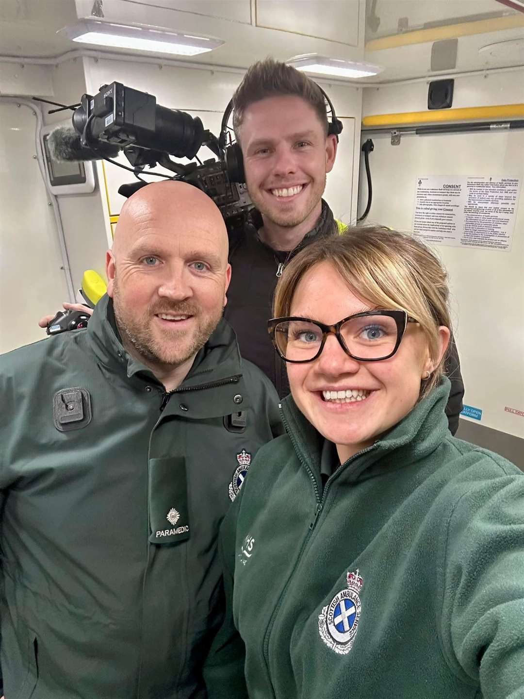 Rachel Brown, technician, and Scott Burnett, paramedic team leader, with cameraman Adam Webster.