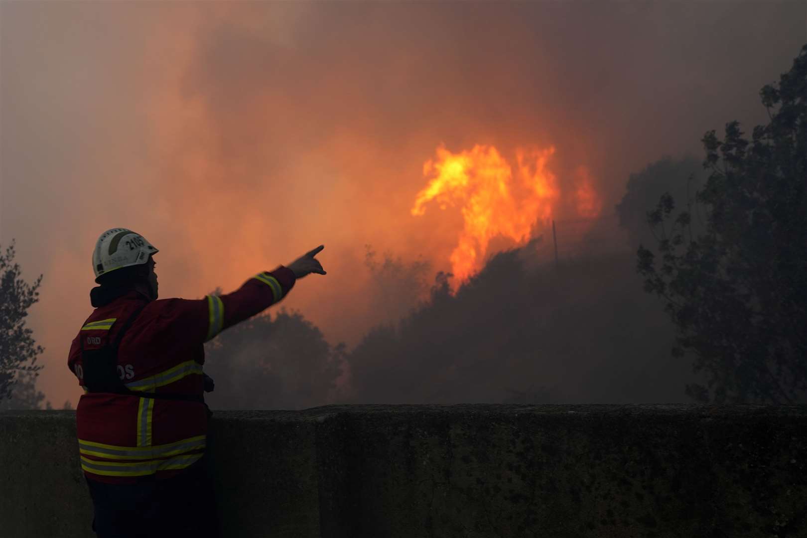 Firefighters have been battling flames across southern Europe (Armando Franca/AP)