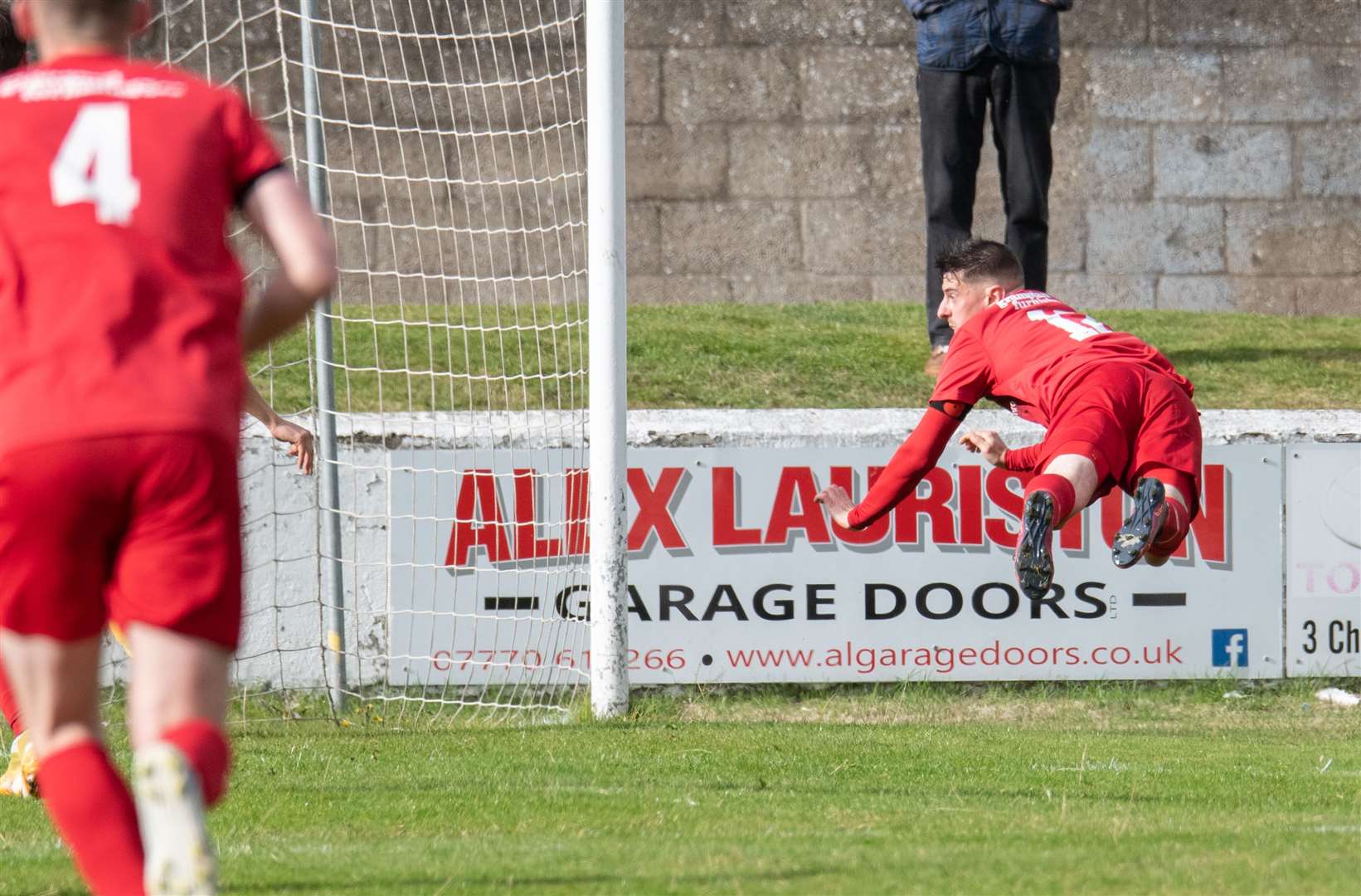 Ross Archibald heads home Lossiemouth's goal. Picture: Daniel Forsyth..