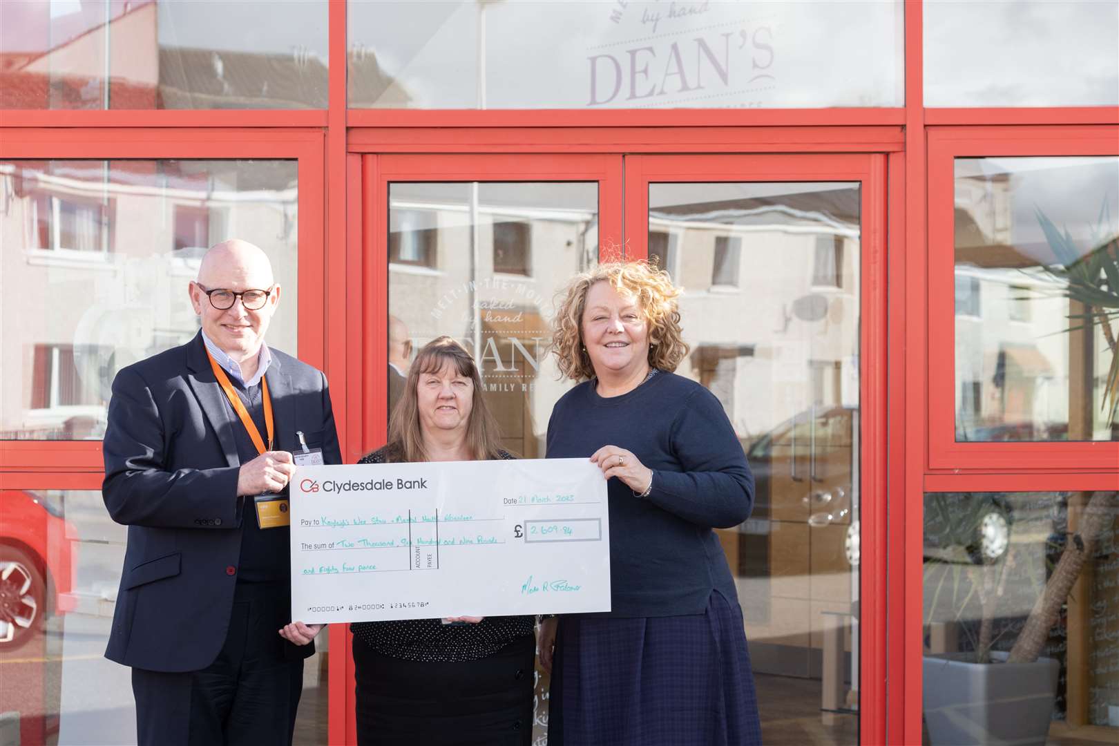Moria Falconer from Dean's of Huntly, flanked by Graeme Kinghorn and Fiona Heinonen, the respective CEOs of Mental Health Aberdeen and Kayleigh's Wee Stars. Picture: Beth Taylor.
