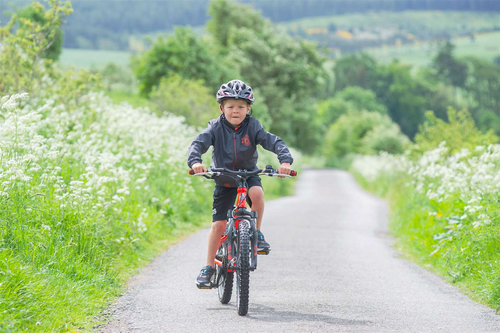 Six-year-old Lewis Mackay, from Keith, has raised £3780 for Breast Cancer Now so far – with the total still rising – and has almost reached the half-way point in his 100-mile challenge. Picture: Daniel Forsyth.