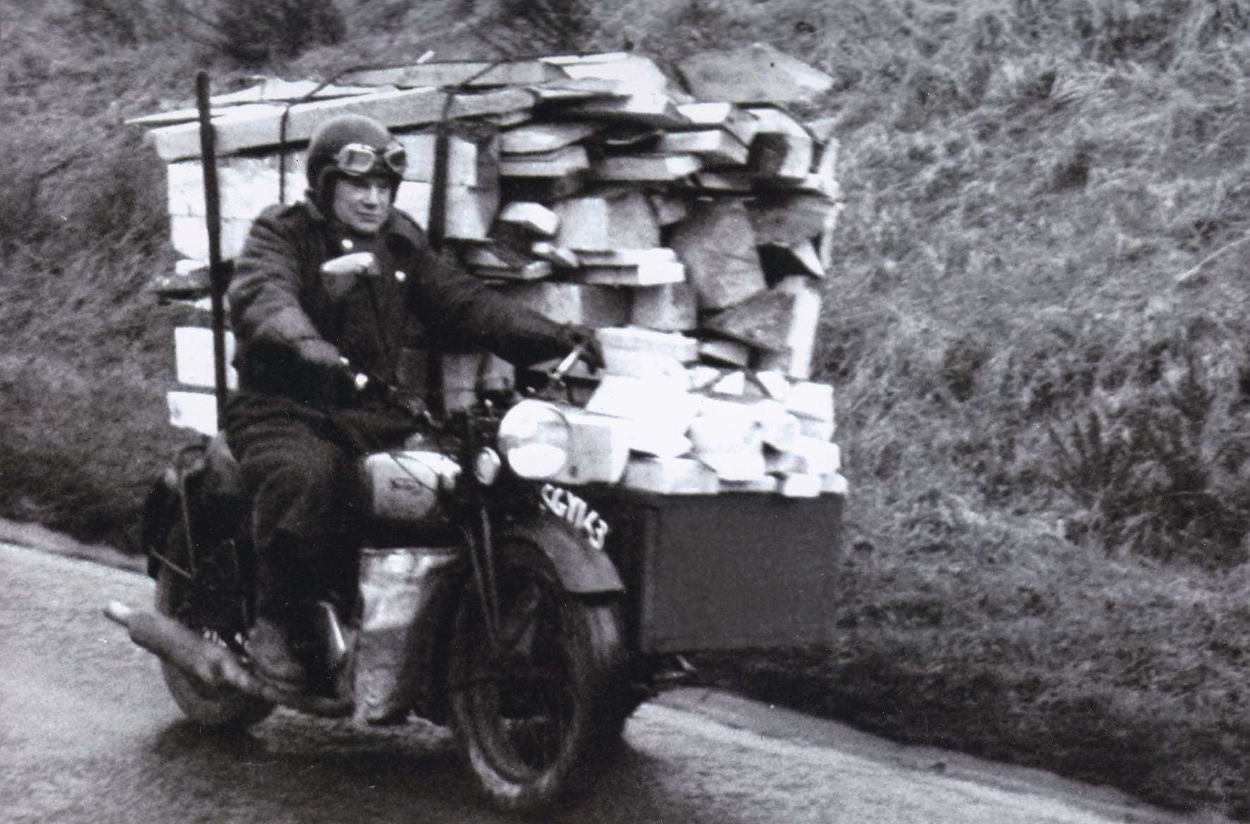 Norman Birse on his iconic Norton motorbike delivering firewood.