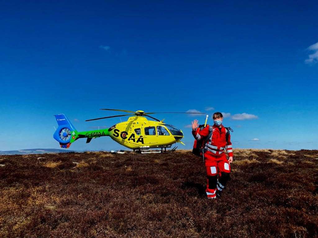 Paramedic Claire Allan with the air ambulance on Bennachie.
