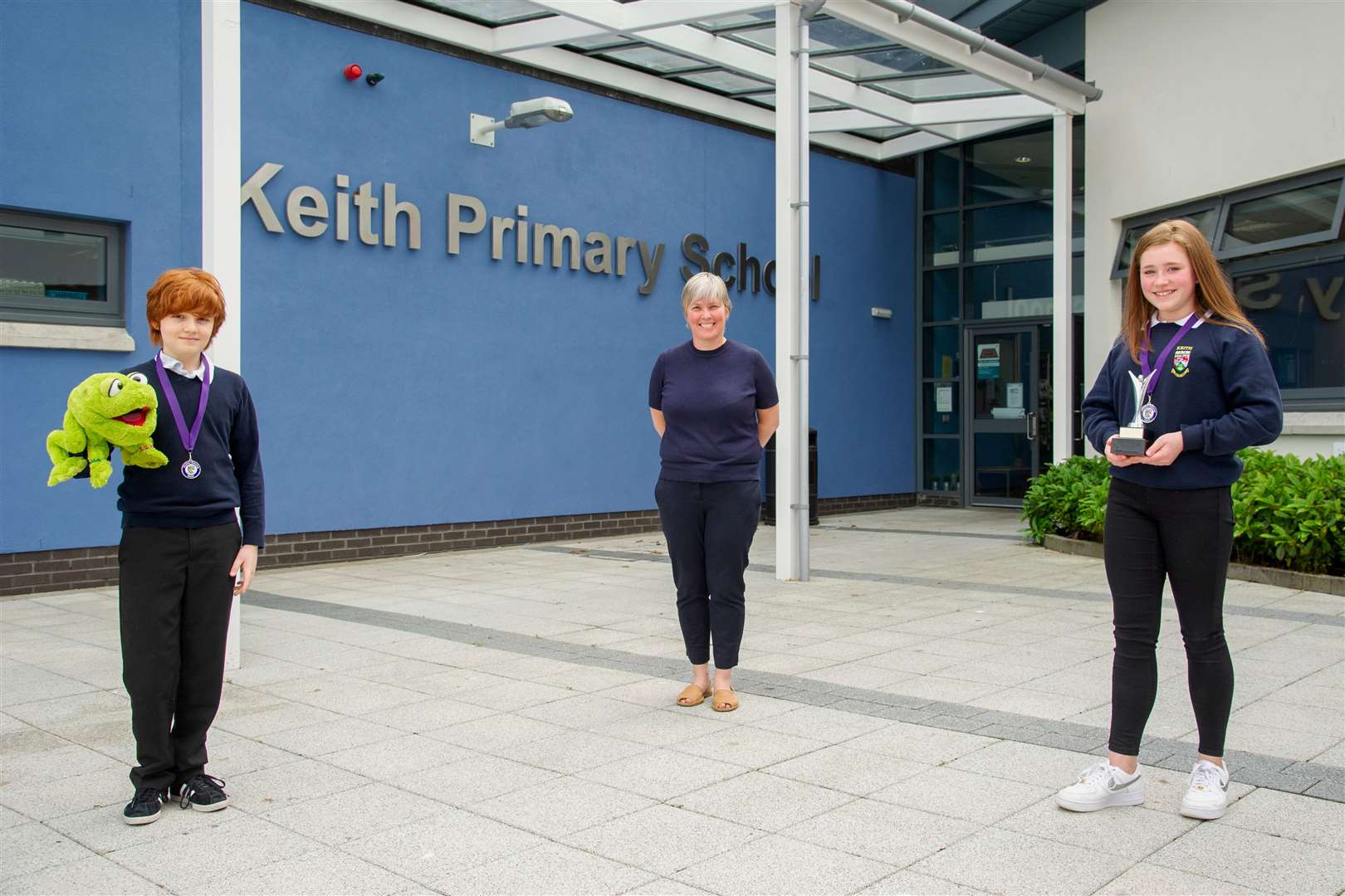Keith Primary School Headteacher Susan Buchan presents Primary Seven leavers Harry Grant and Kassidy Walker with the 2020 Heather Stanning award...Picture: Daniel Forsyth..