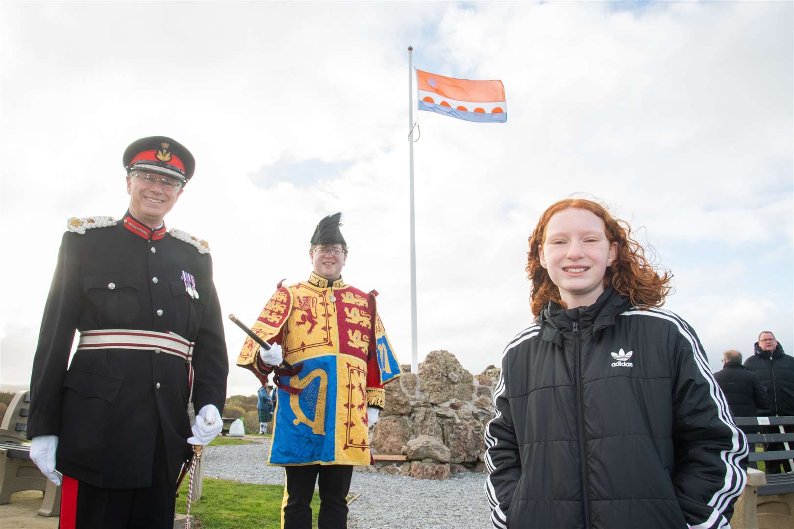 (From left) Lord Lieutenant of Banffshire Andrew Simpson, March Pursuivant and Honorary Vexillologist Philip Tibbetts and flag design winner Ellie Stewart of Portessie Primary. Picture: Daniel Forsyth
