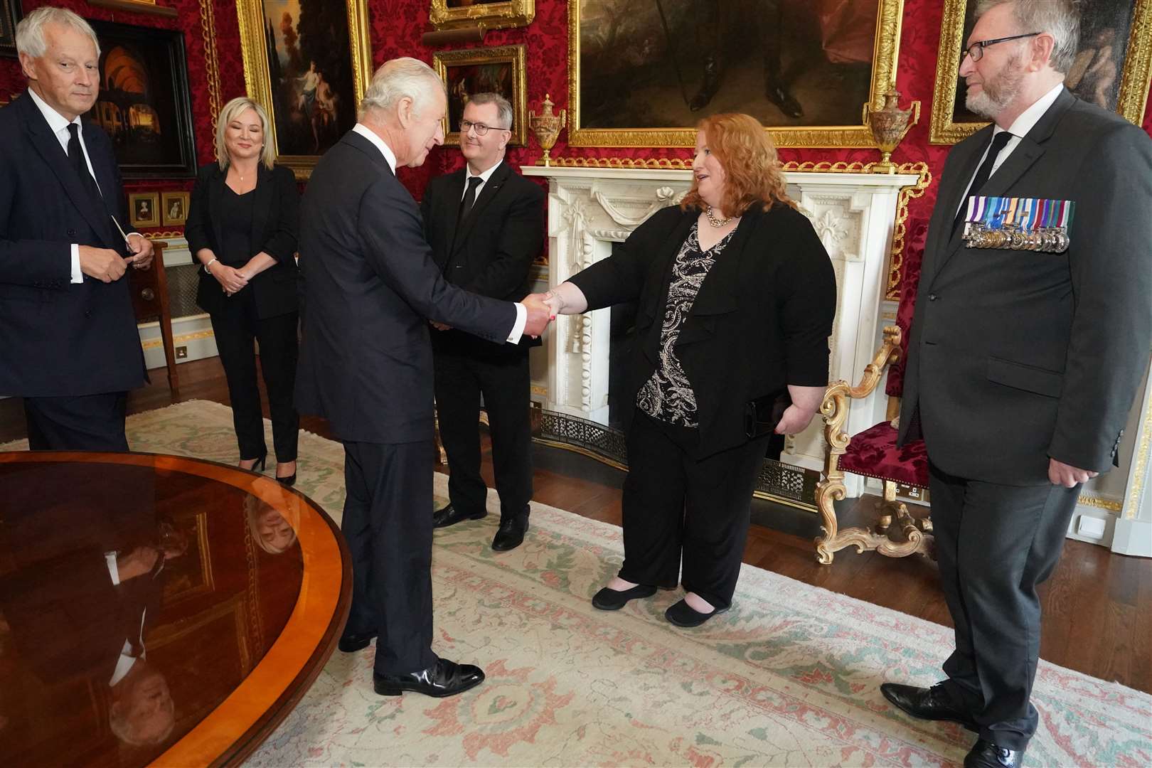 King Charles III shaking hands with Alliance Party leader Naomi Long (Niall Carson/PA)