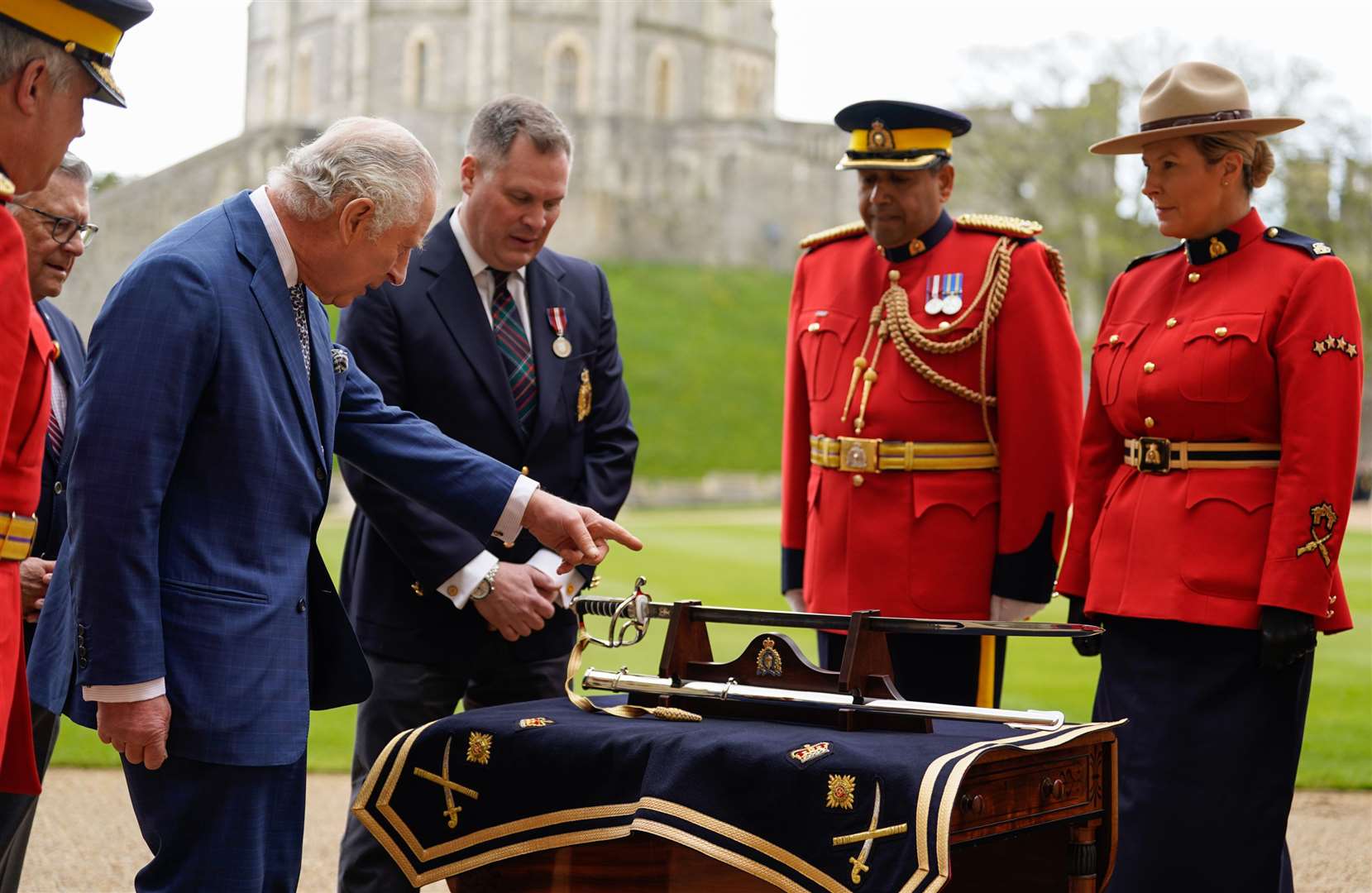 Charles III is presented with the sword (Andrew Matthews/PA)