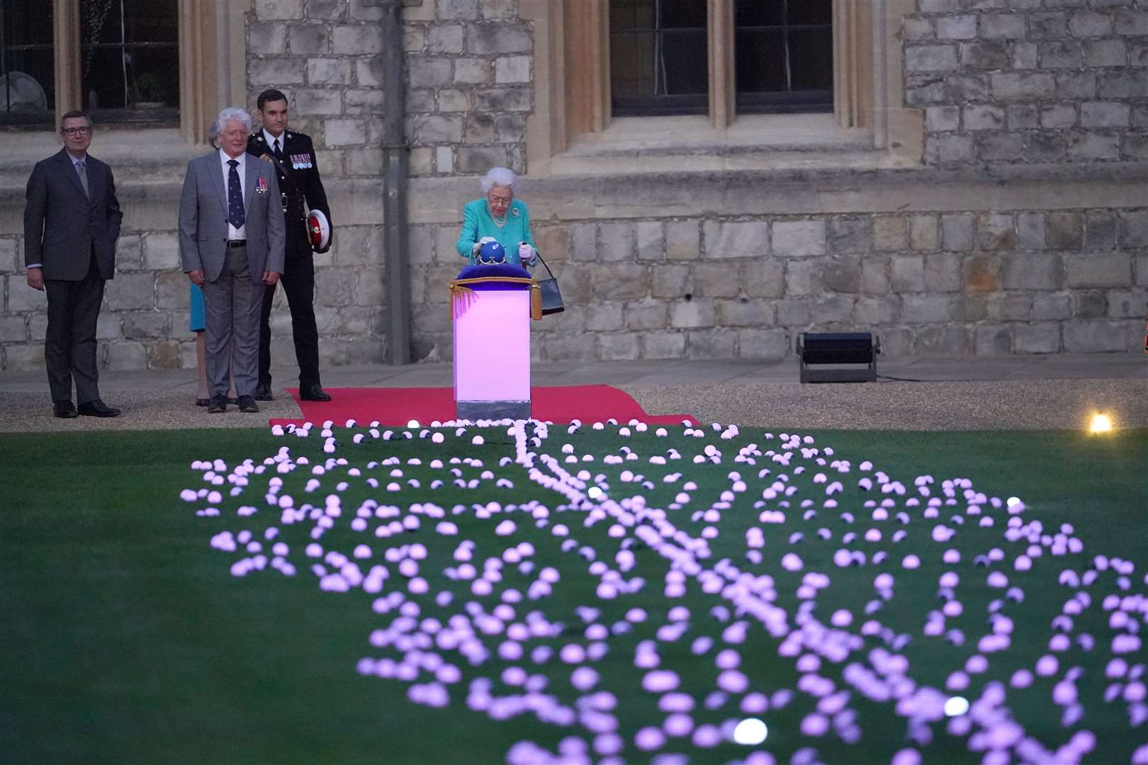 The Queen leads the lighting of the principal beacon at Windsor Castle (Jonathan Brady/PA)