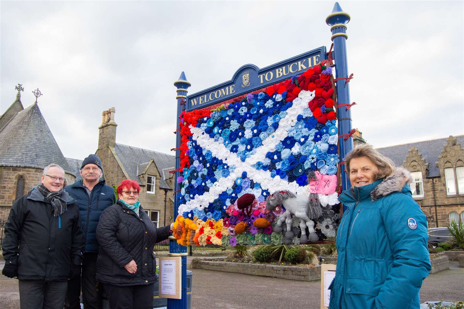 Joining Buckie's Roots chairwoman Meg Jamieson (third left) in admiring the Auld Lang Syne panel are group volunteers (from left) Gifford Leslie, Archie Jamieson and Sandra Simpson. Picture: Daniel Forsyth