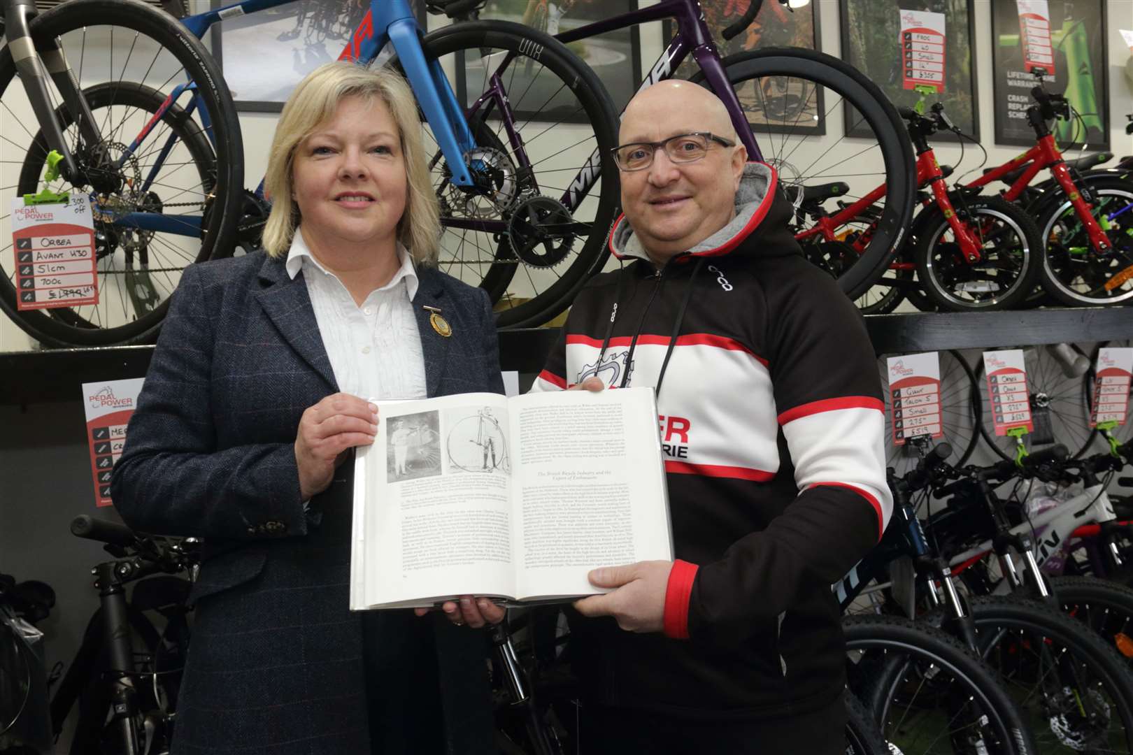 Judy Whyte and Mark Fraser with a copy of the Illustrated History of Cycling which tells the story of Ian Keith-Falconer. Picture: David Porter