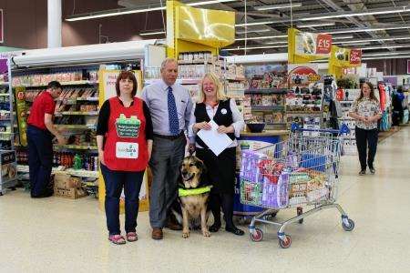 MSP Dennis Robertson with foodbank co-ordinator Debbie Parry (left) and Tracey McBain from Tesco.
