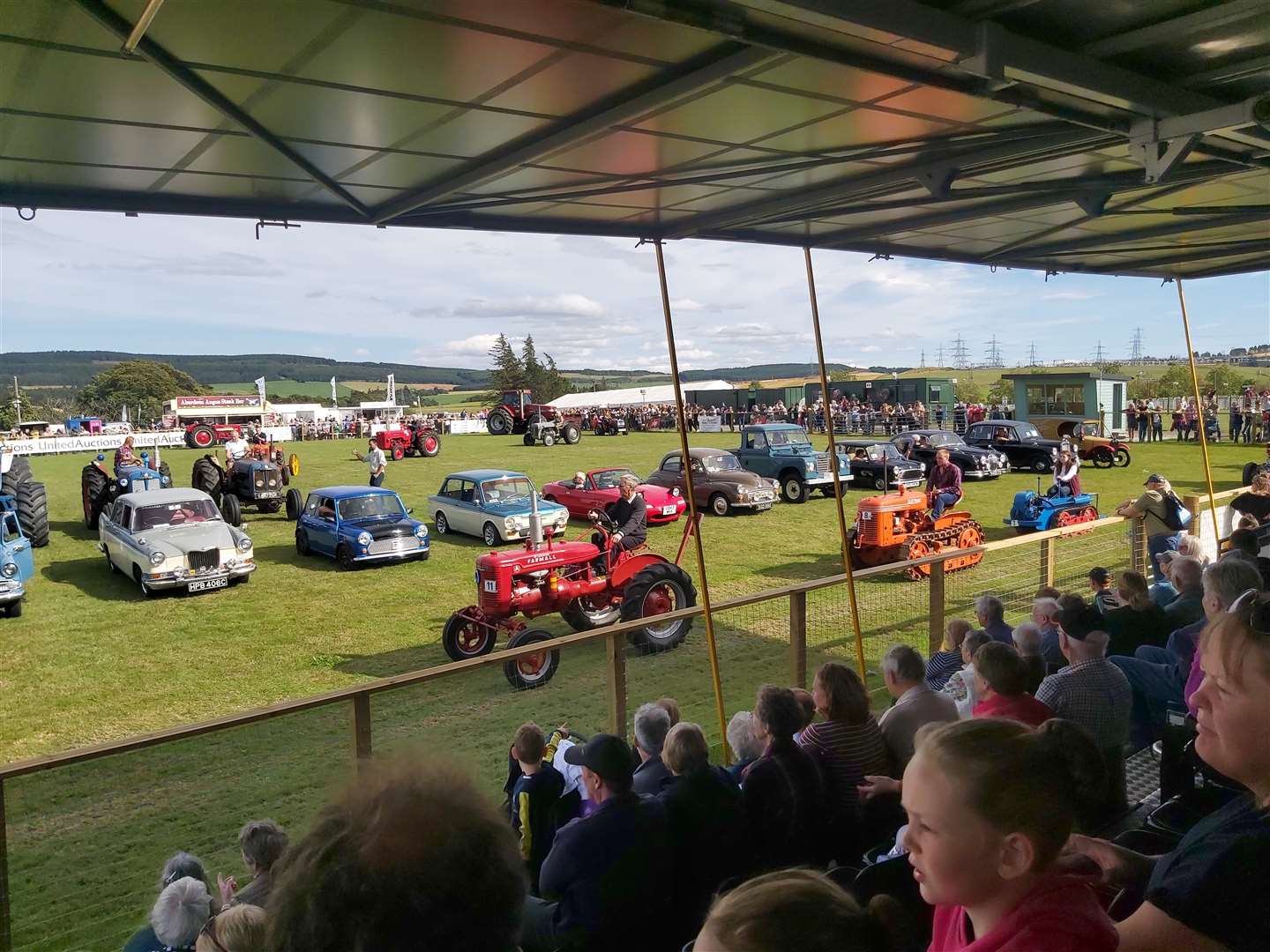 Vintage vehicles enter the arena at Keith.