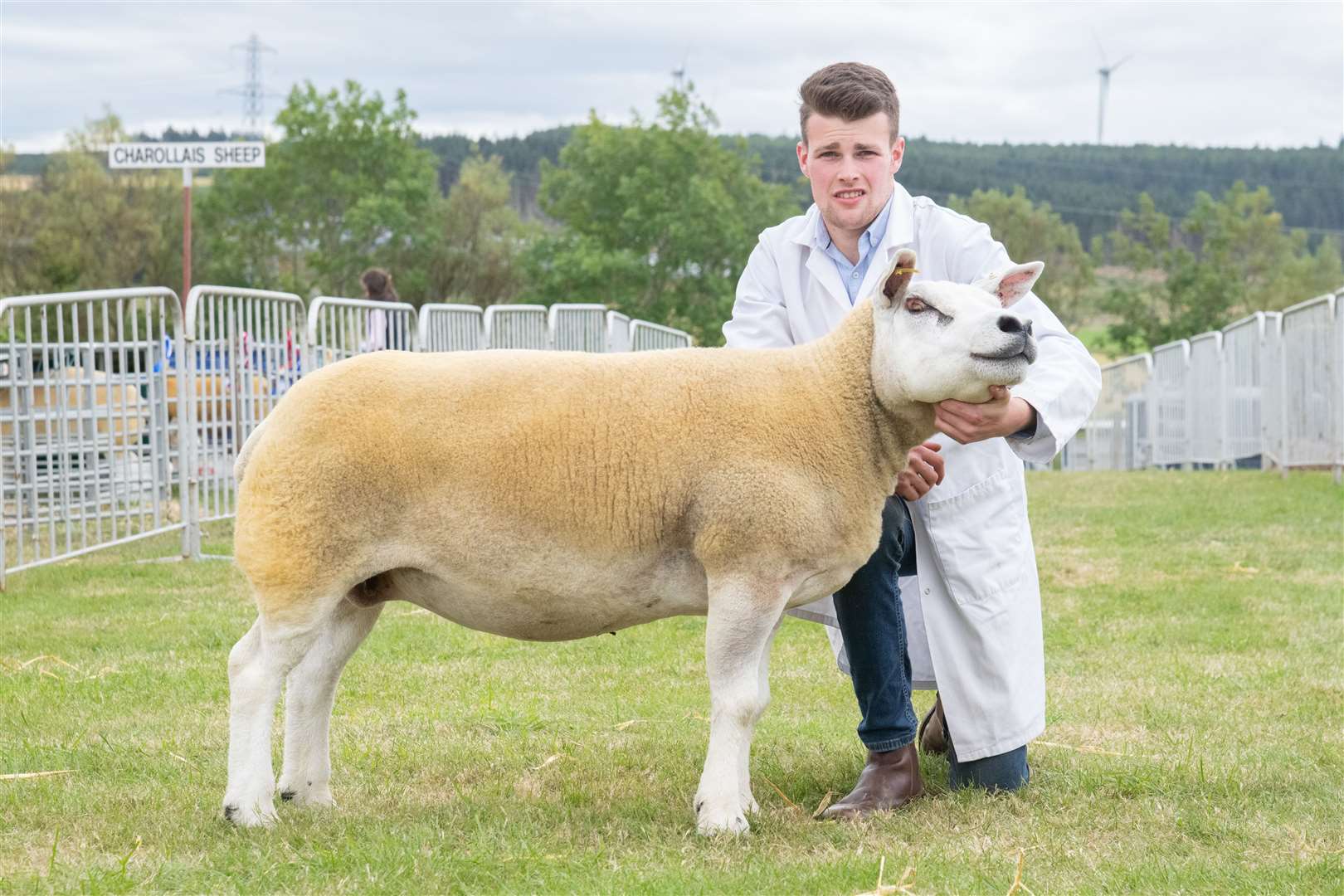 Archie Knox with the overall sheep champion, a Texel ewe. Picture: Daniel Forsyth
