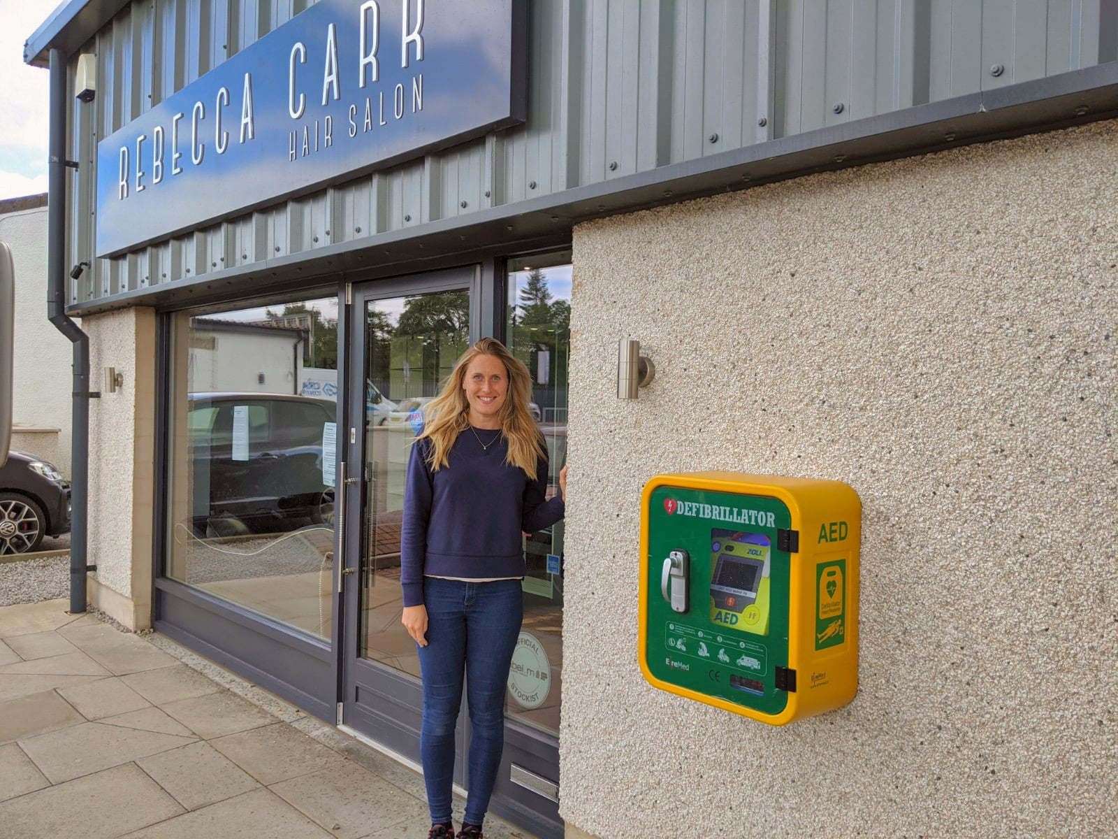 Rebecca Carr with the new defibrilator.
