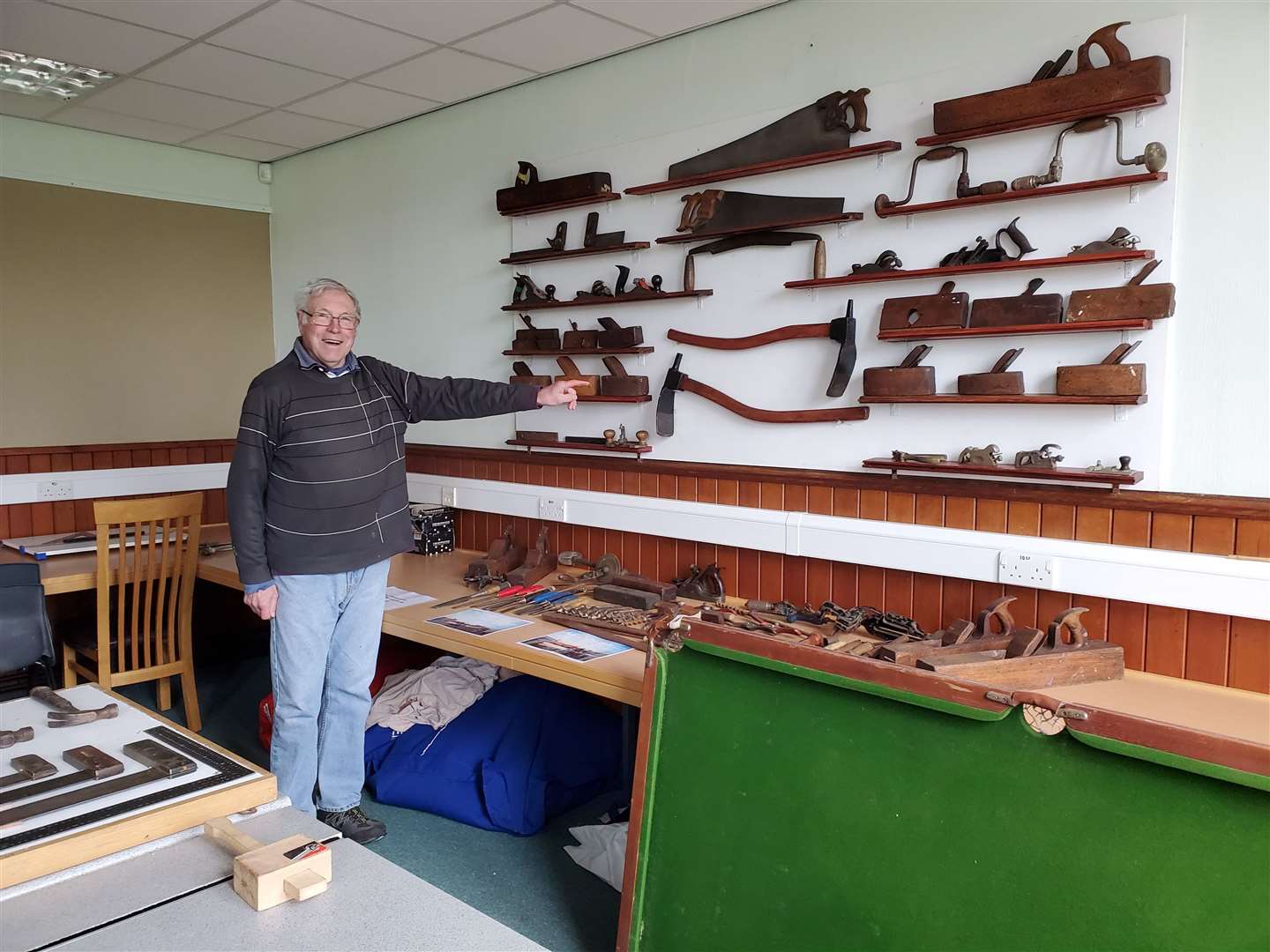 Alfie Wood with the tools at Banff, Macduff and District Men's Shed.